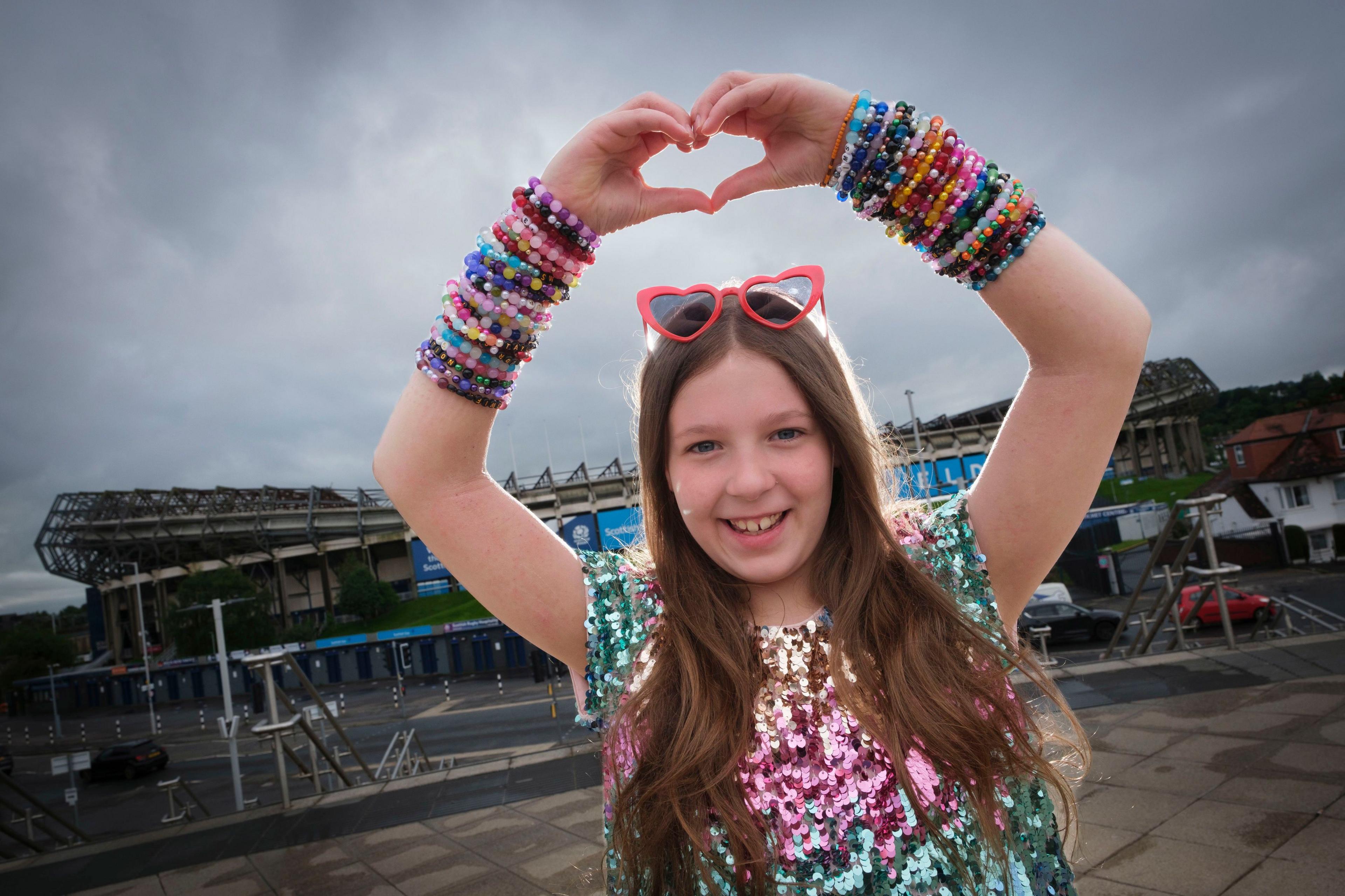 Devon making a heart shape with her hands