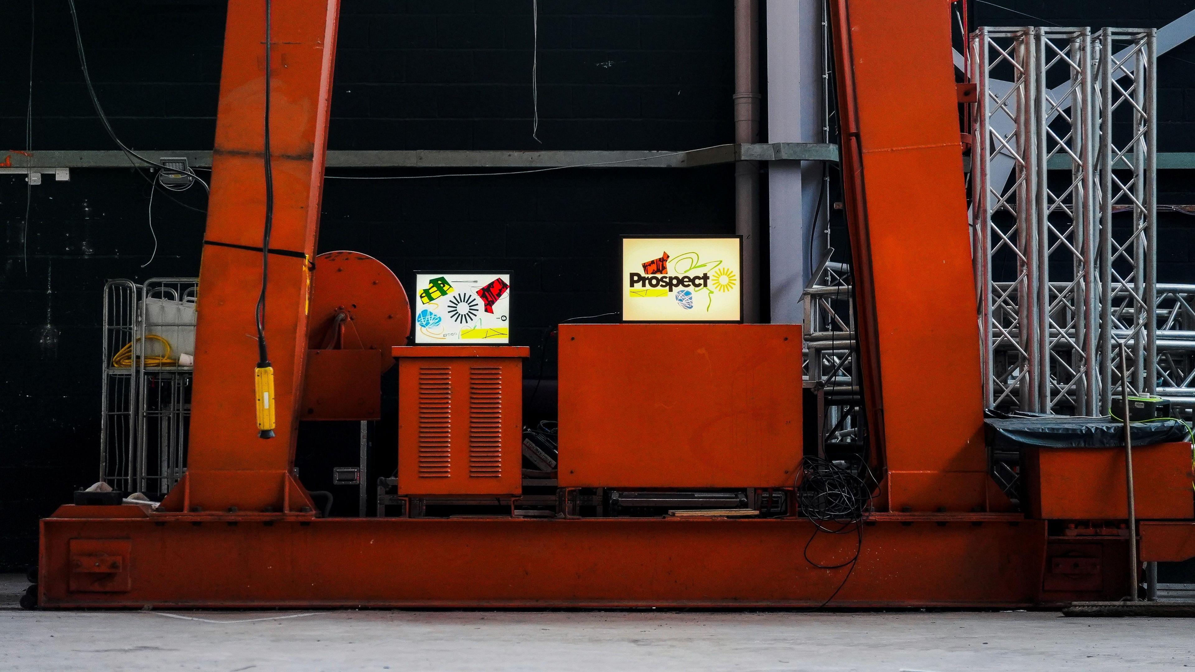 Red pillars and signage reading 'Prospect' in a warehouse