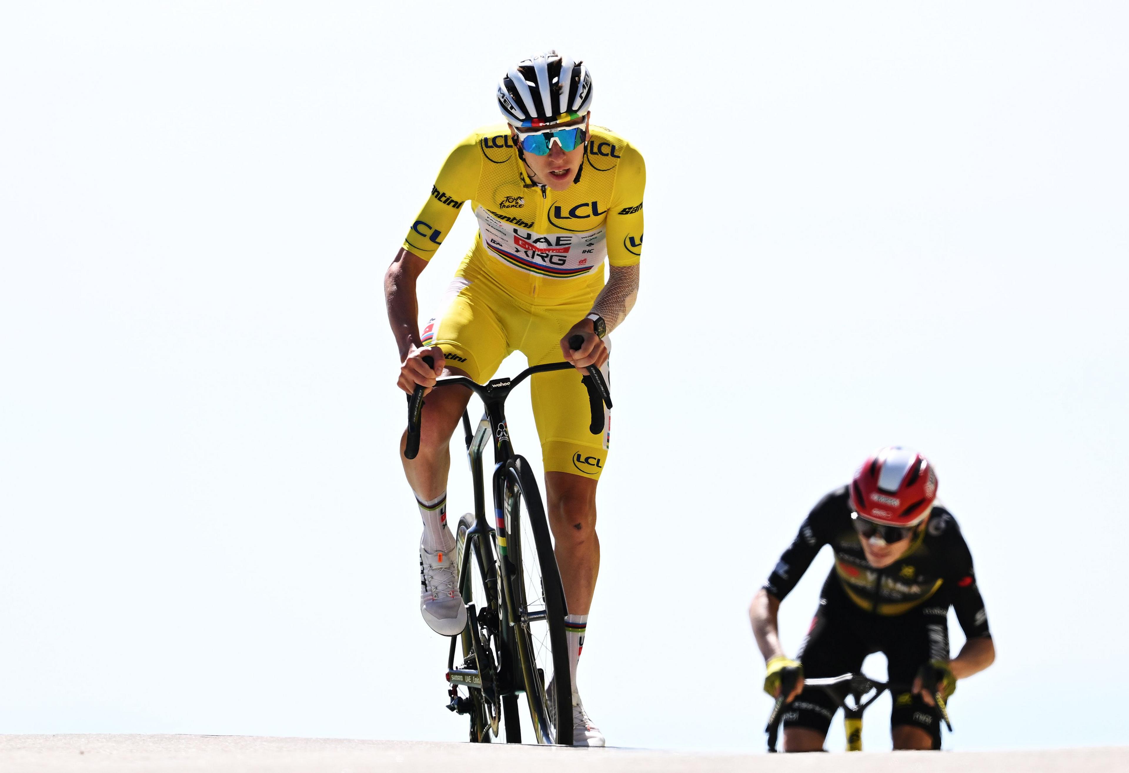 Tadej Pogacar moves ahead of rival Jonas Vingegaard while racing up Mount Ventoux during the Tour de France. Photo by Tim de Waele