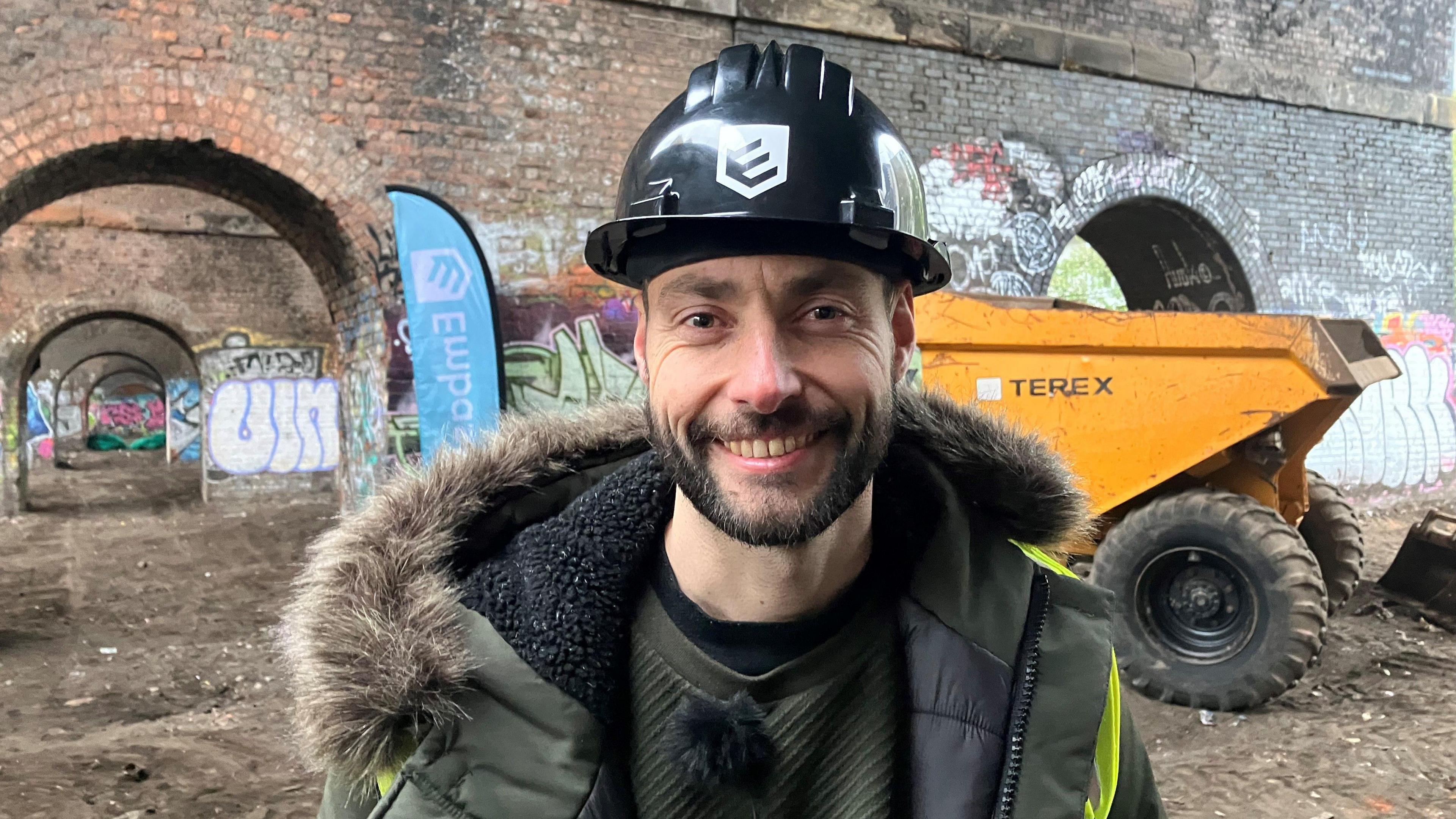 Photograph of Sid Williams, who runs the Embassy homeless charity - underneath a railway arch in Castlefield