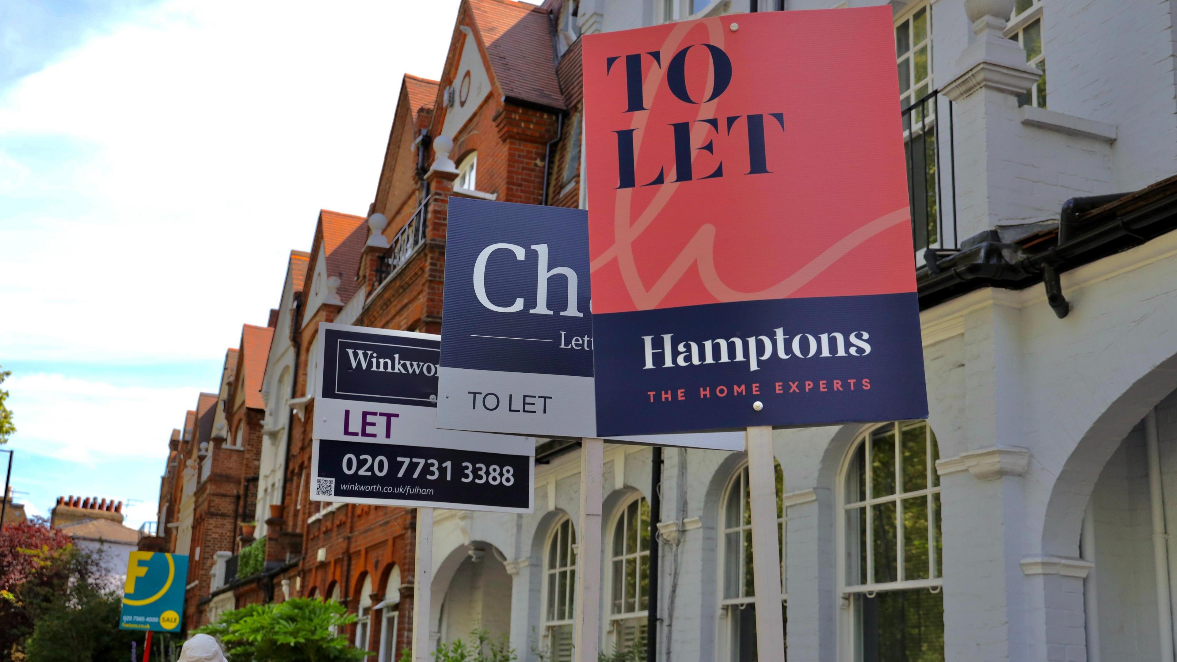 To let signs outside a row of properties.