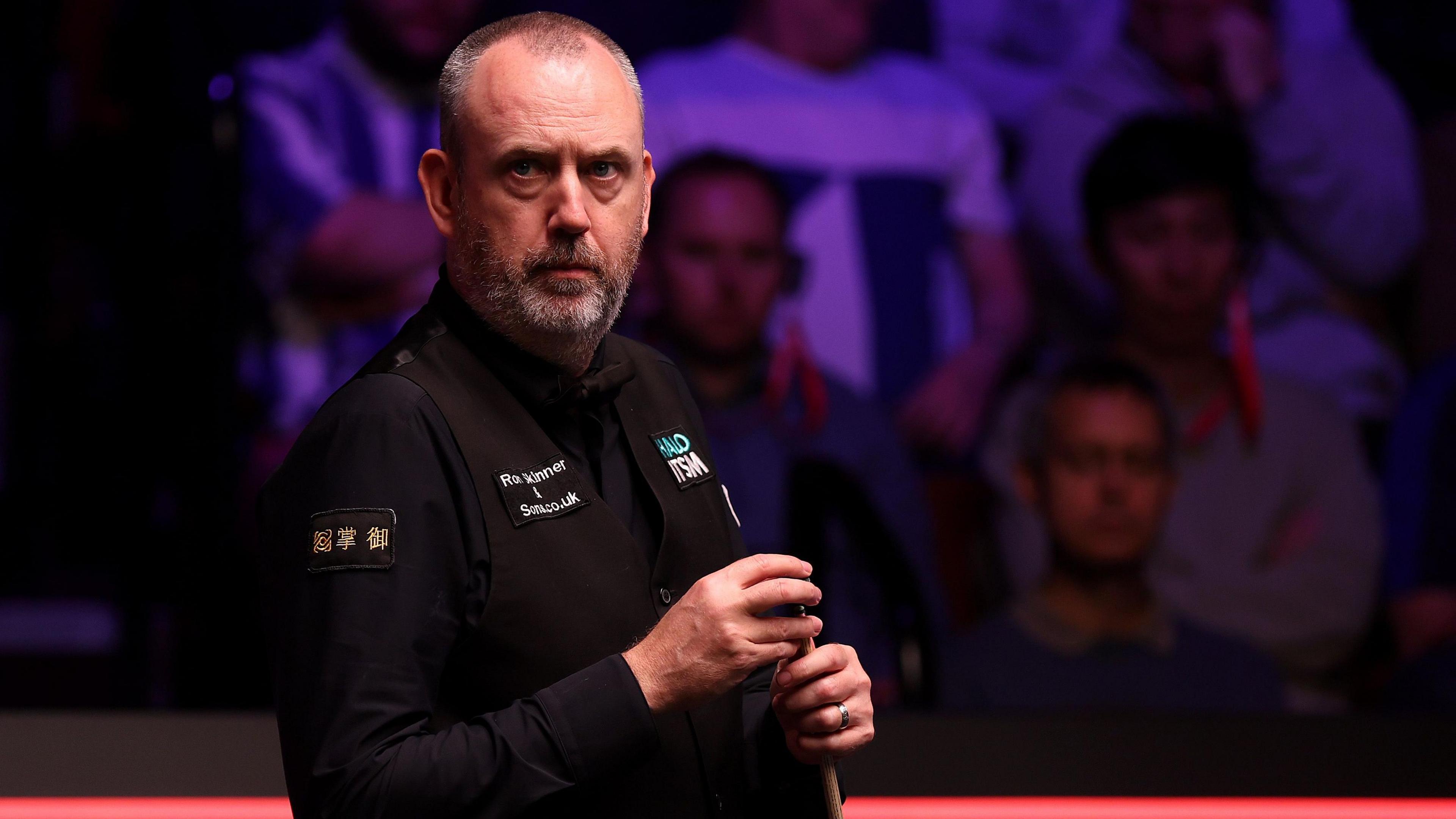 Mark Williams chalks his cue