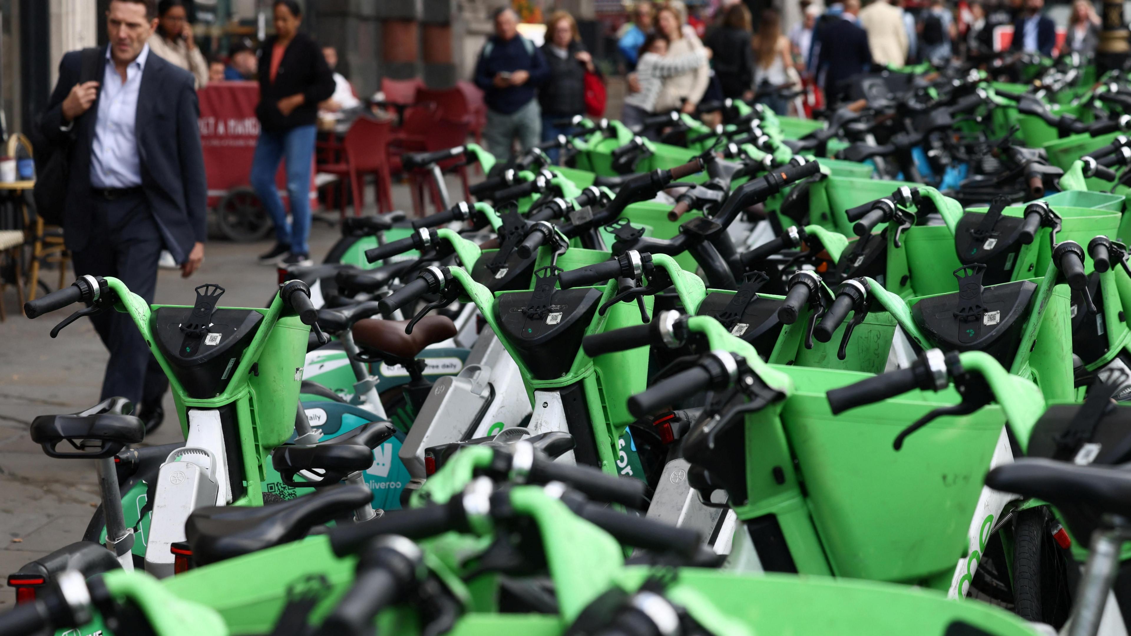 Hundreds of lime bikes are left in a street