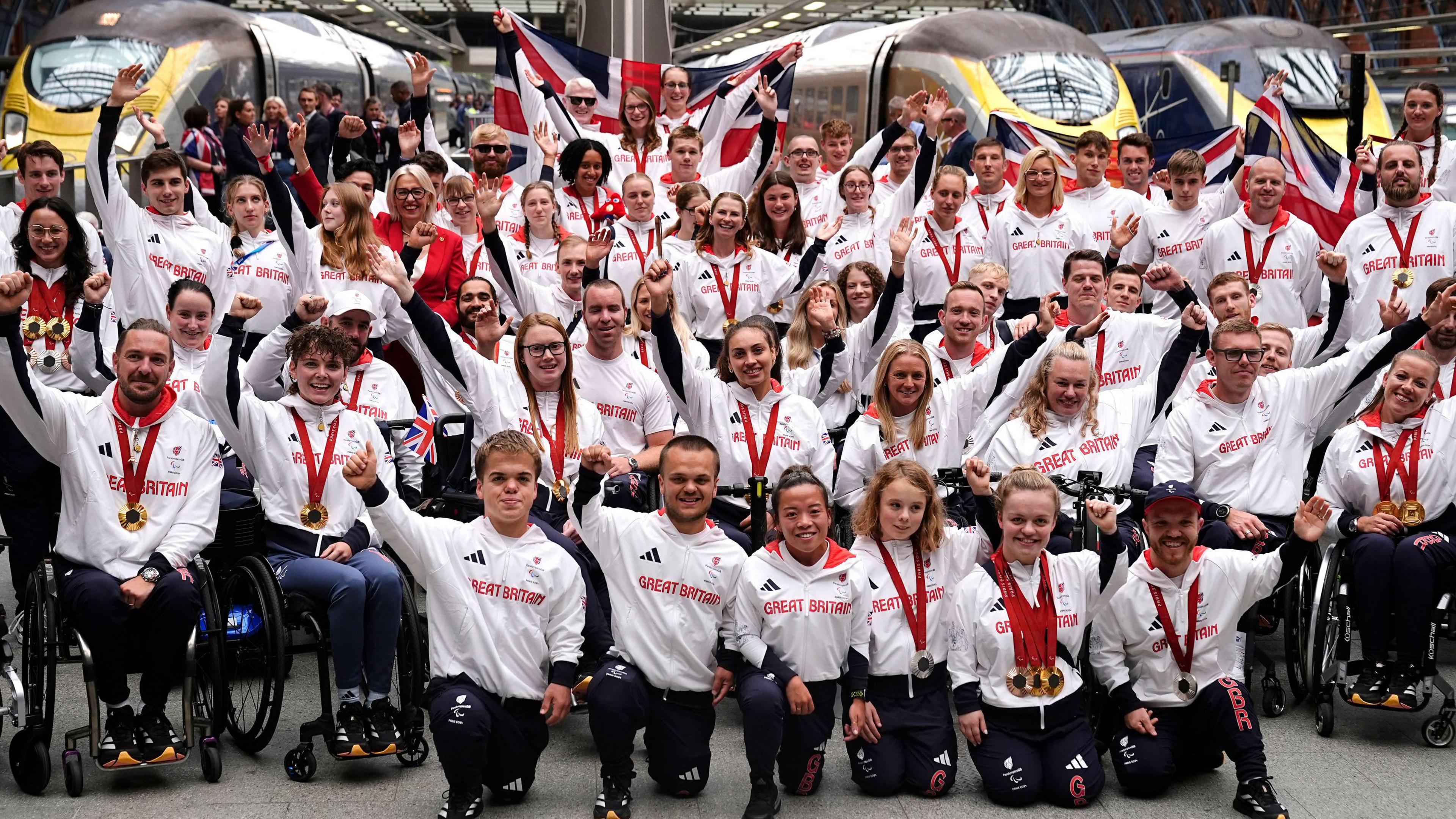 Team Paralympics GB pose for photographs after arriving by Eurostar