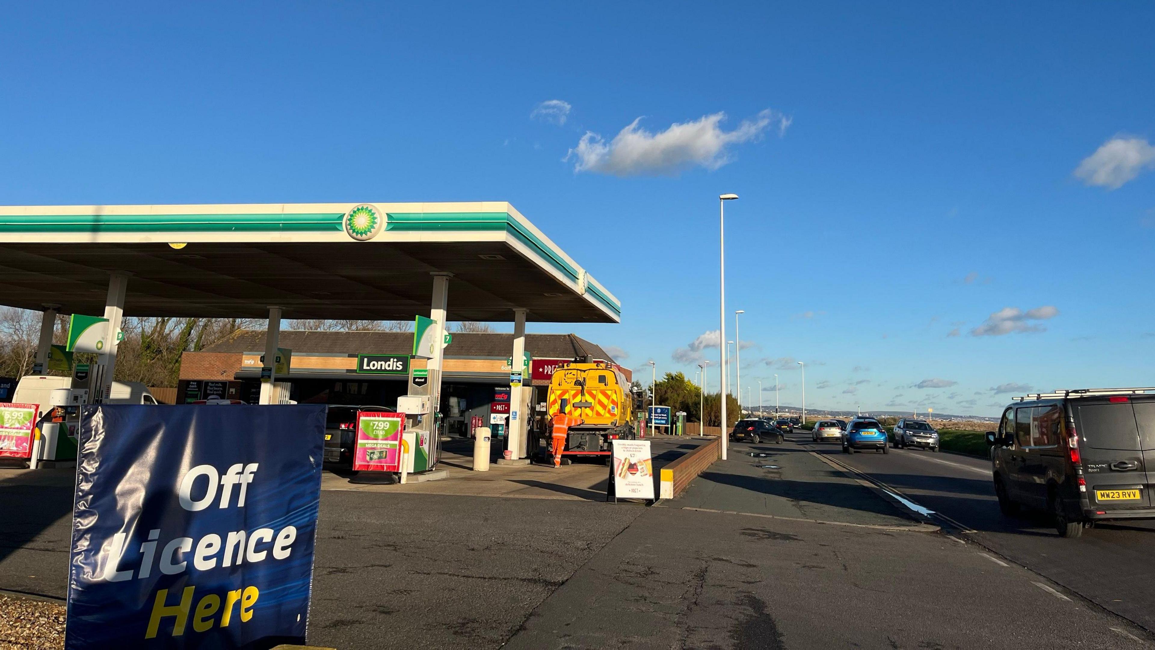 The forecourt of Brooklands Service Station in Worthing, showing petrol pumps and a shop, with an off licence sign