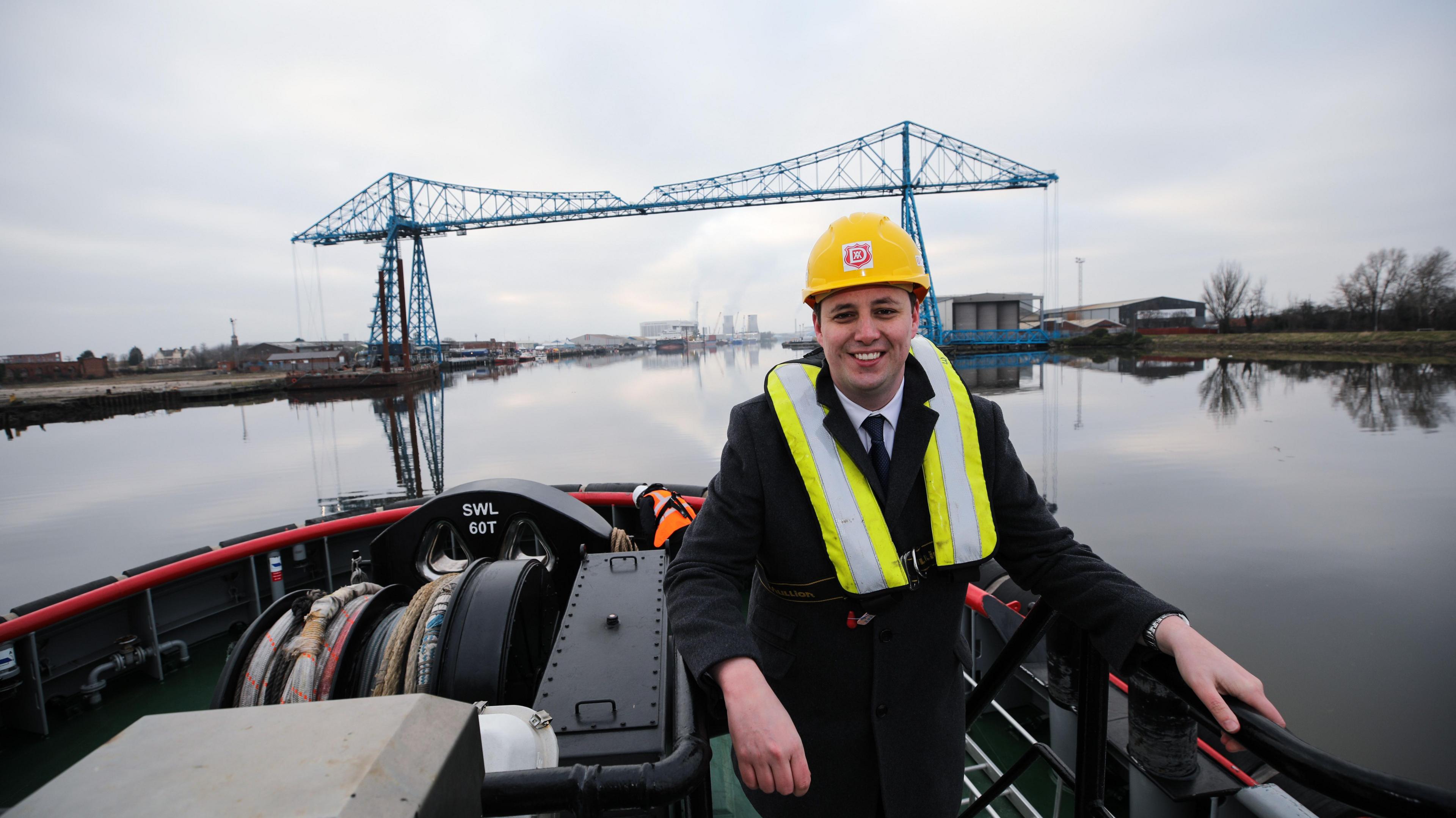 Mayor Ben Houchen on a boat on the River Tees in front of the Transporter Bridge