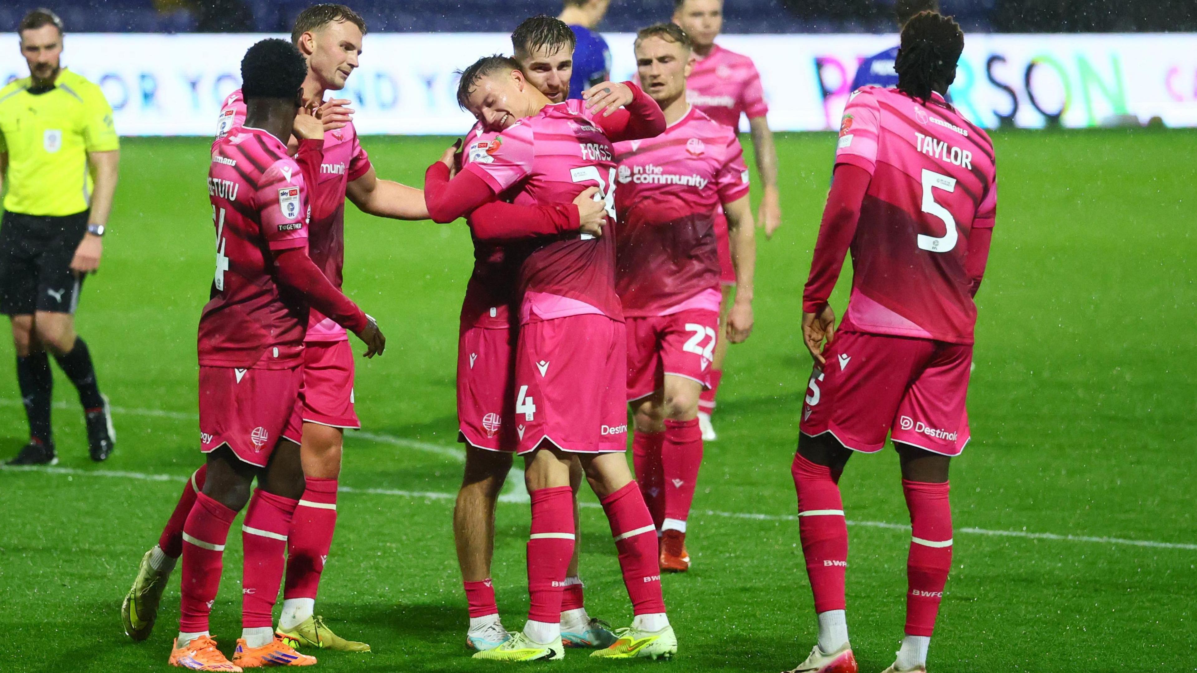 Marcus Forss celebrates with Bolton teammates