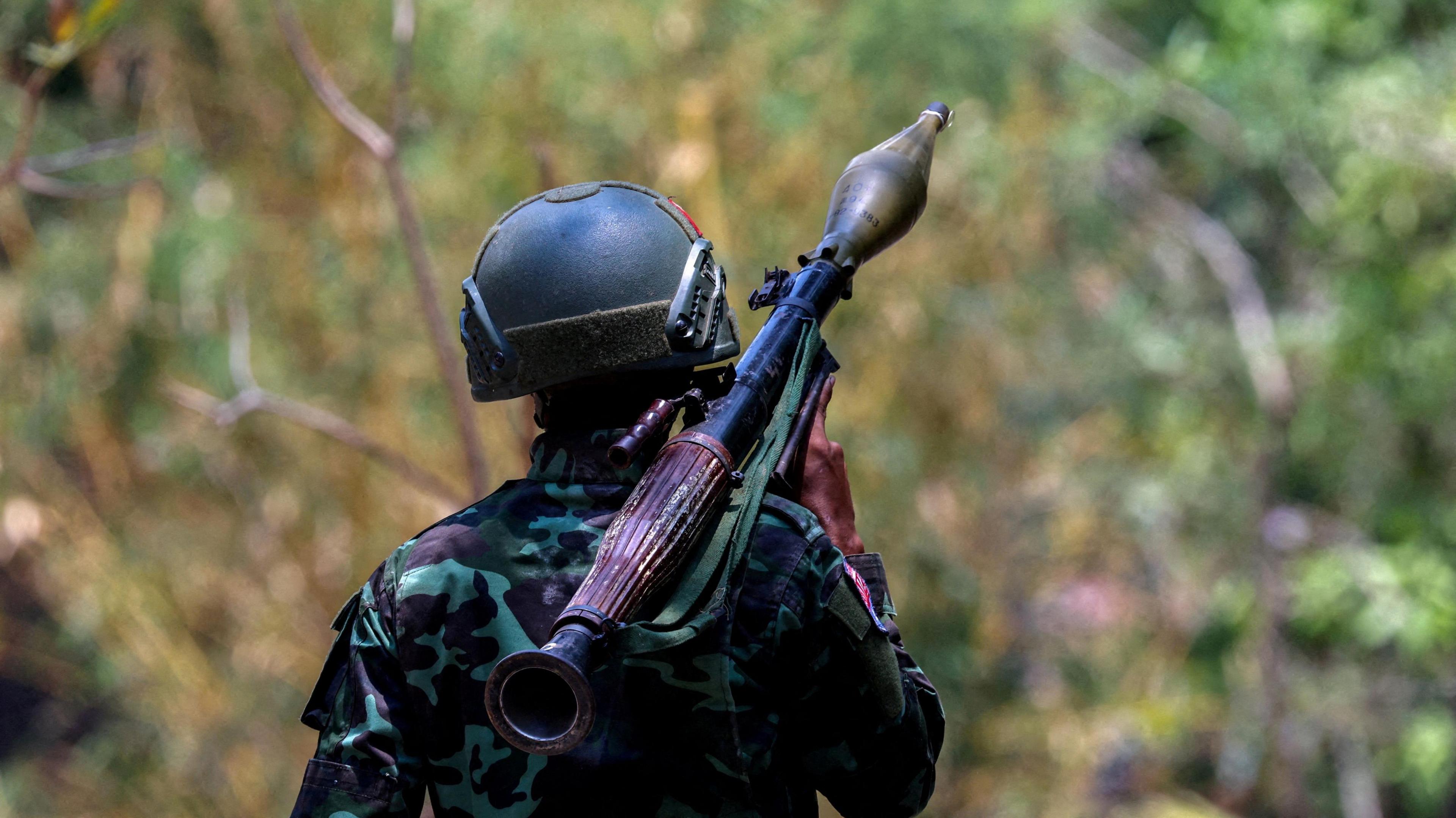 A soldier from the Karen National Liberation Army (KNLA) carries an RPG launcher at a Myanmar military base at Thingyan Nyi Naung village on the outskirts of Myawaddy, the Thailand-Myanmar border townr, April 15, 2024.