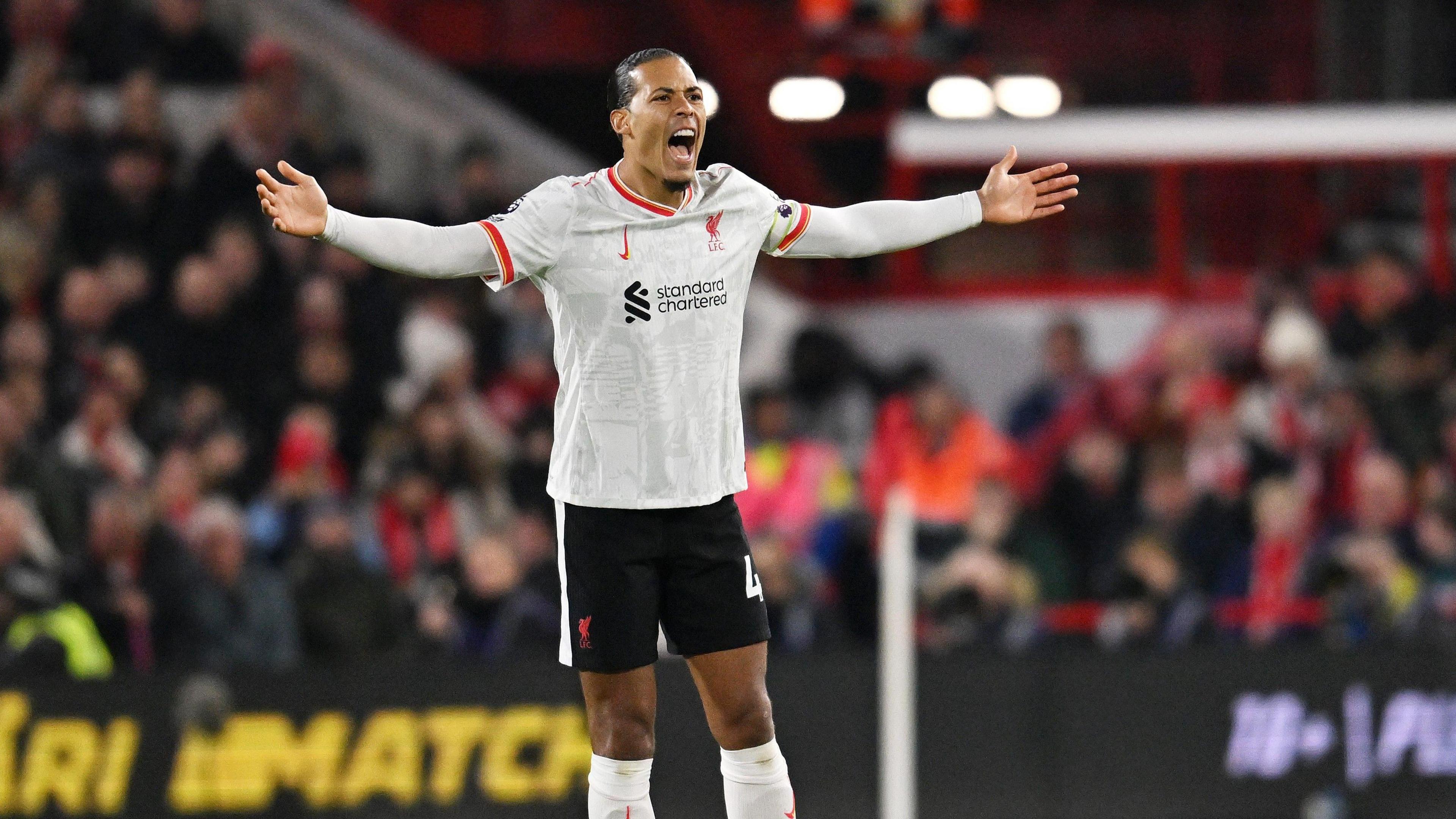 Virgil van Dijk shouts with his arms outstretched during Liverpool's draw with Nottingham Forest. 