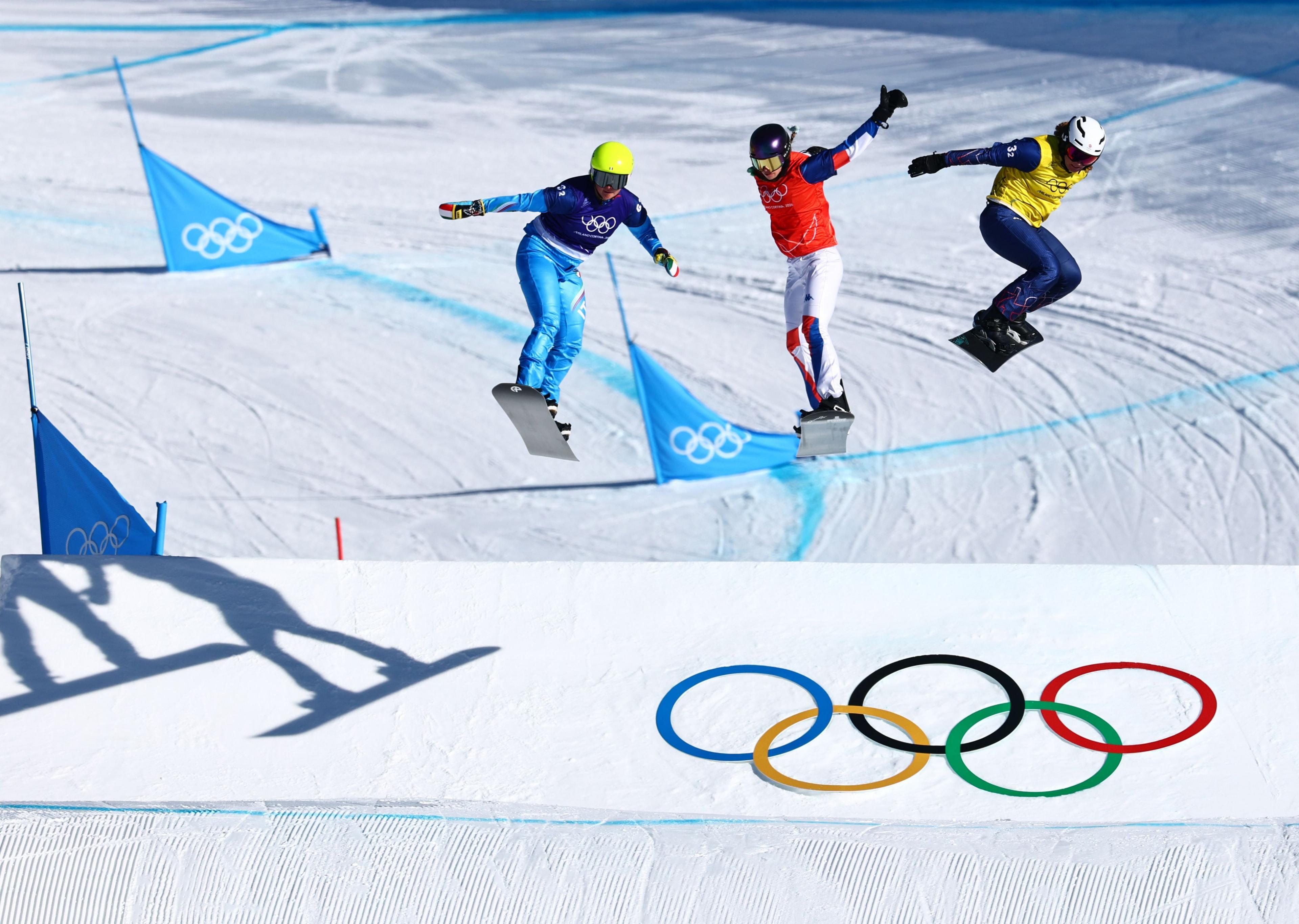 racers in the snowboard cross mixed final