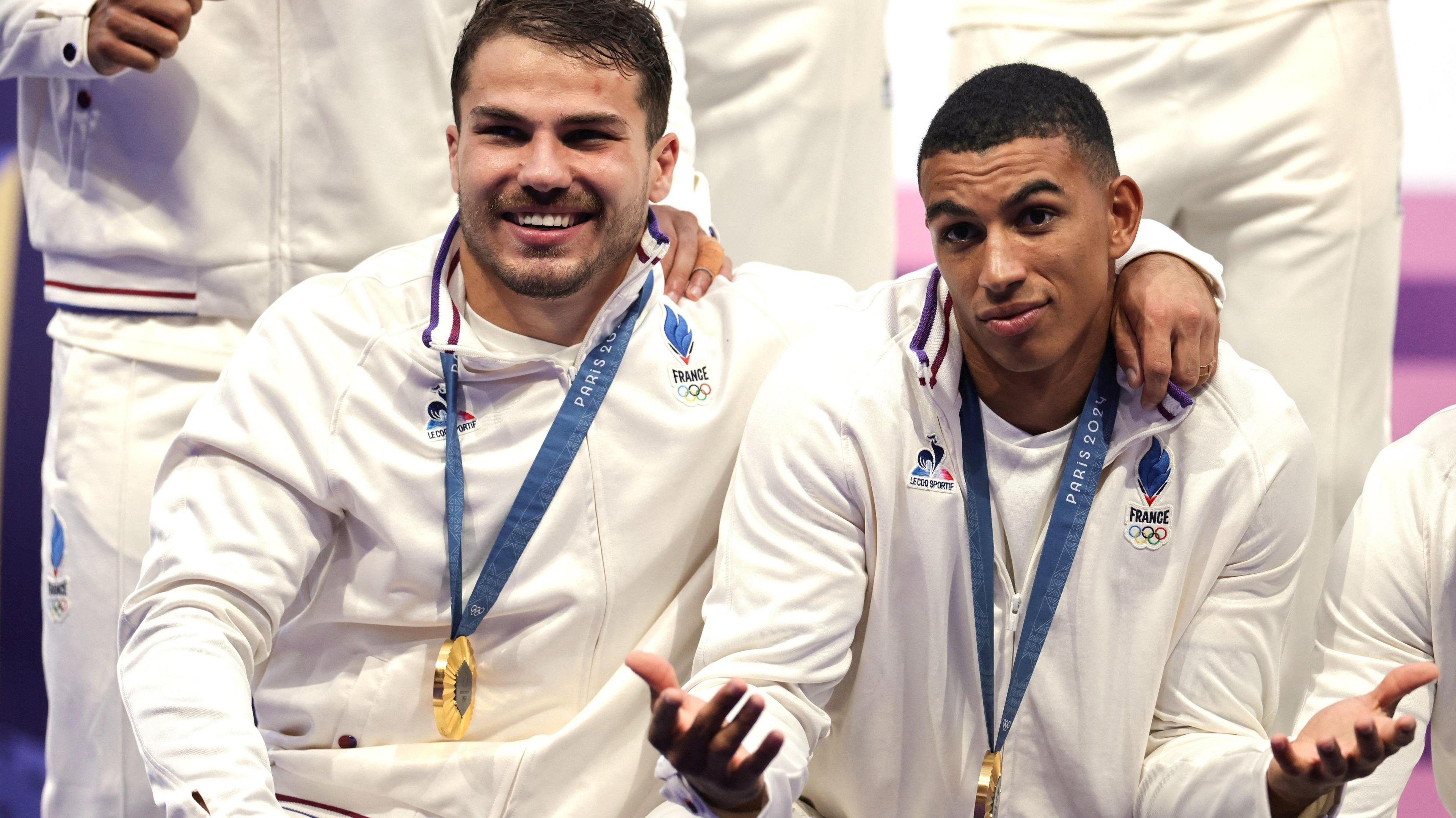 Antoine Dupont with Aaron Grandidier Nkanang at the Olympic medal presentation