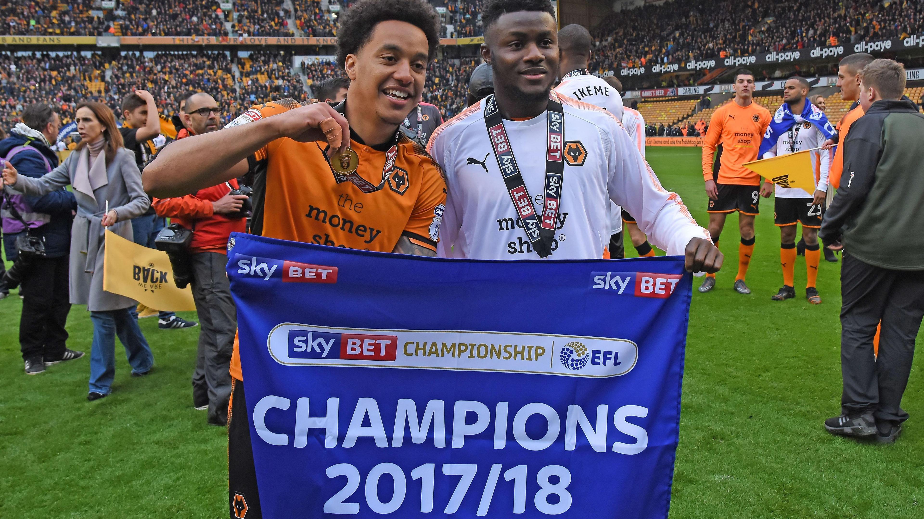 Wolves players hold up Champions 2017-18 banner