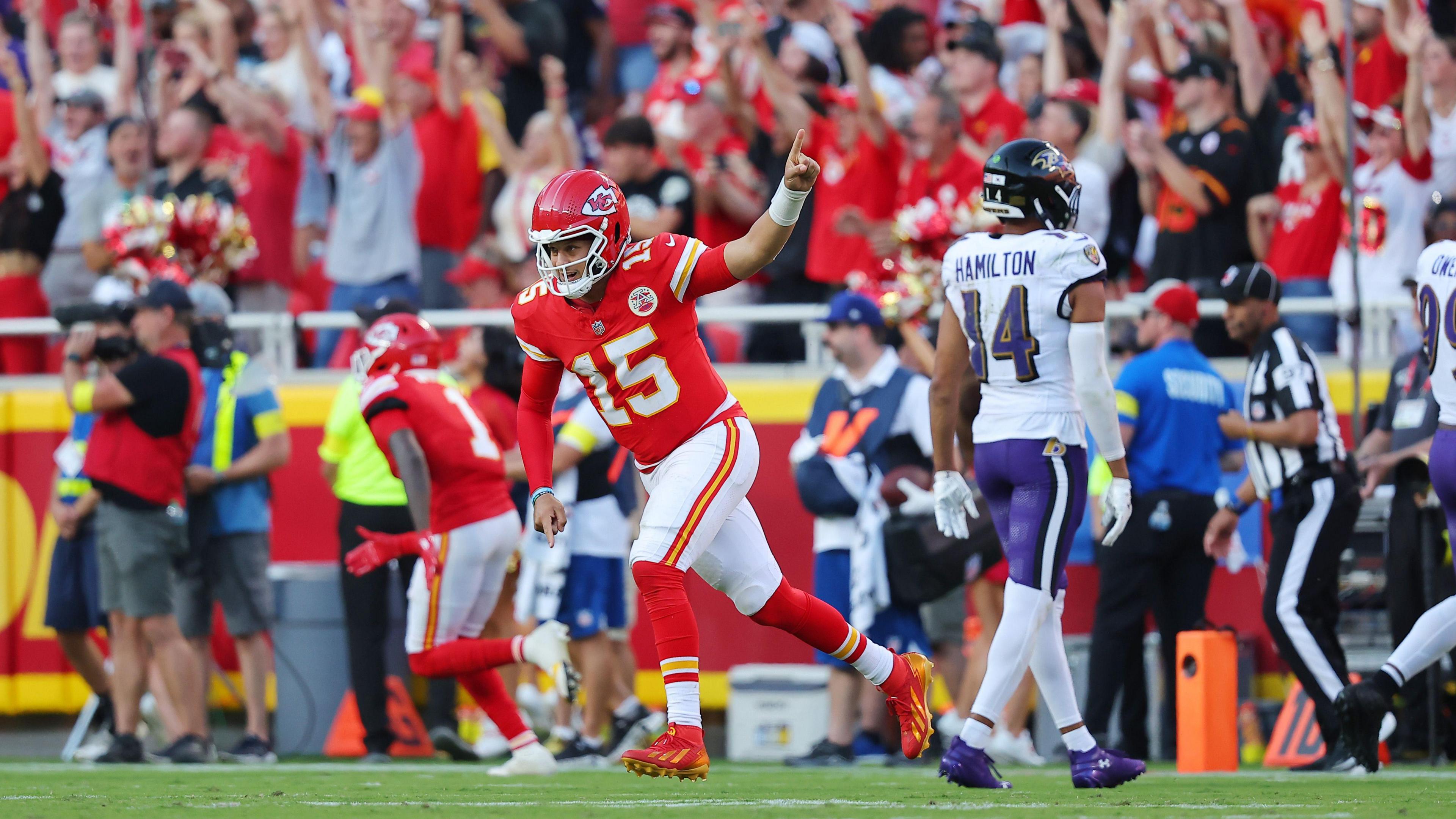 Patrick Mahomes of the Kansas City Chiefs runs away in celebration after scoring a touchdown against the Baltimore Ravens in the NFL