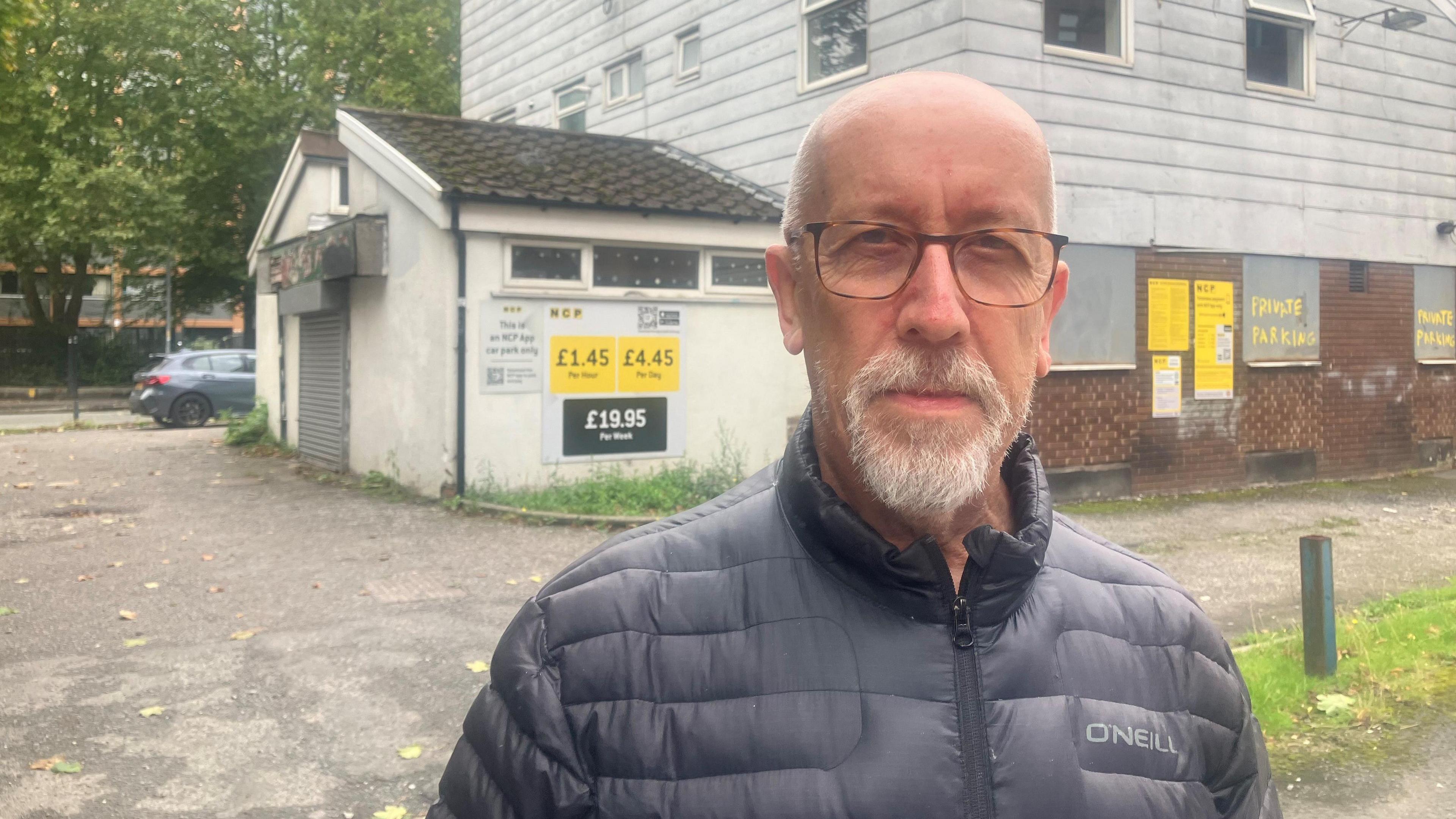 Campaigner from Block the Block, Roger Howard, stands in front of the boarded up Gamecock pub in Hulme.