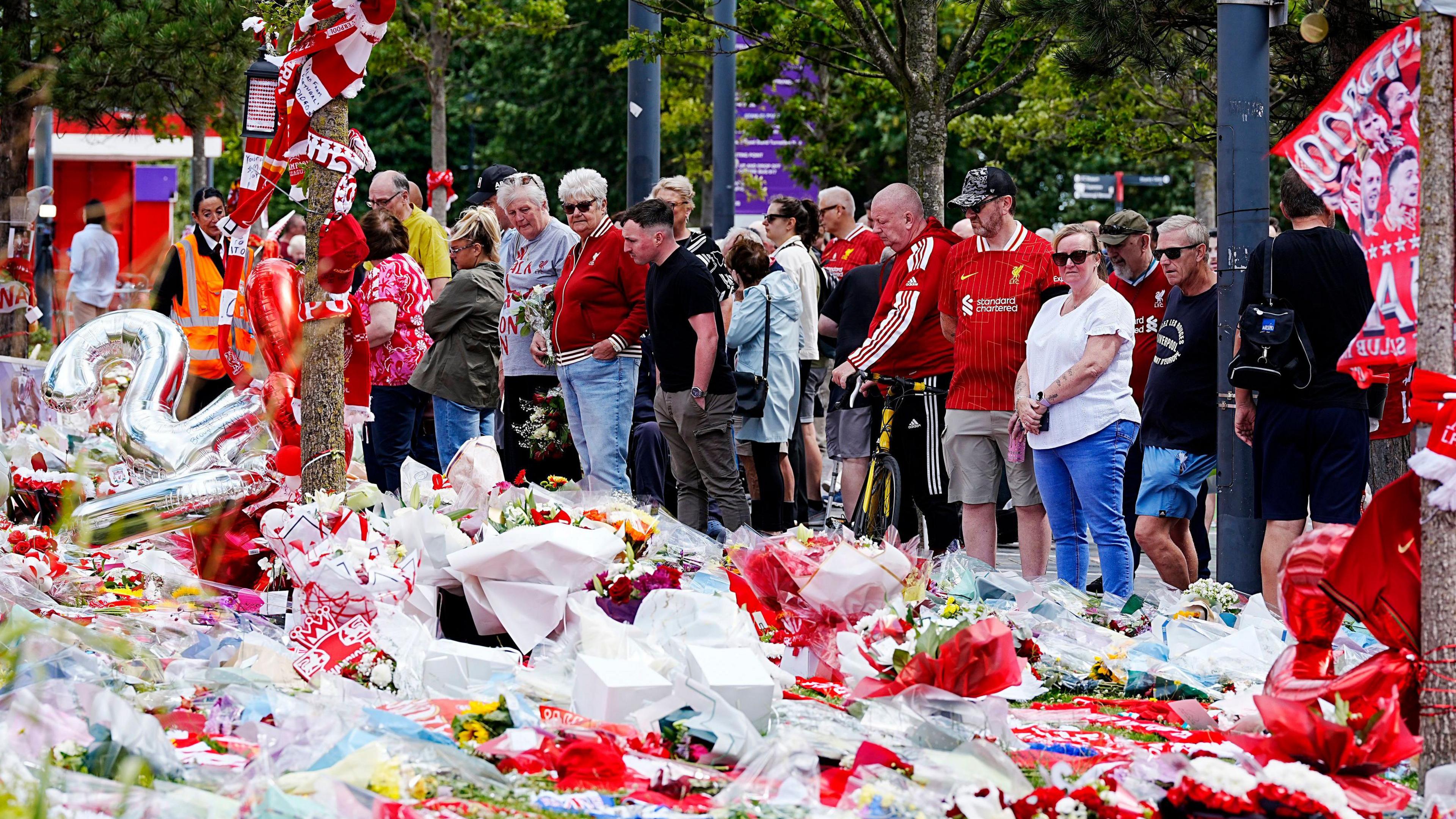 Tributes at Anfield Stadium, home of Liverpool, in memory of Diogo Jota who has died at the age of 28.