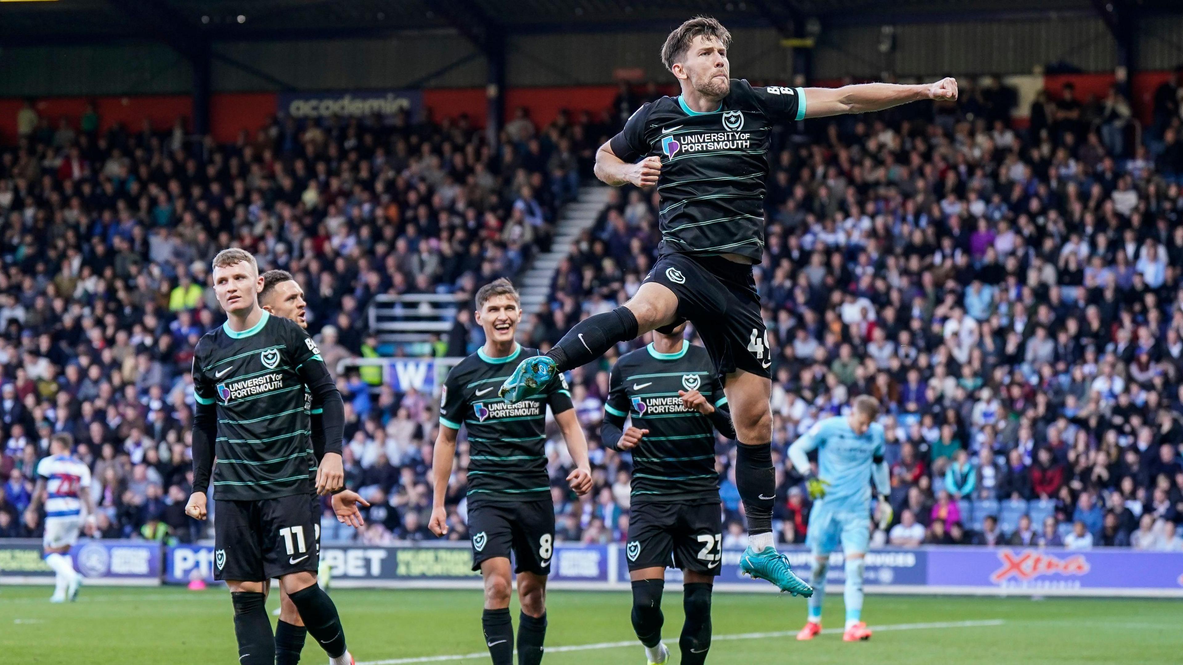 Portsmouth's Callum Lang celebreating scoring the winning goal at QPR