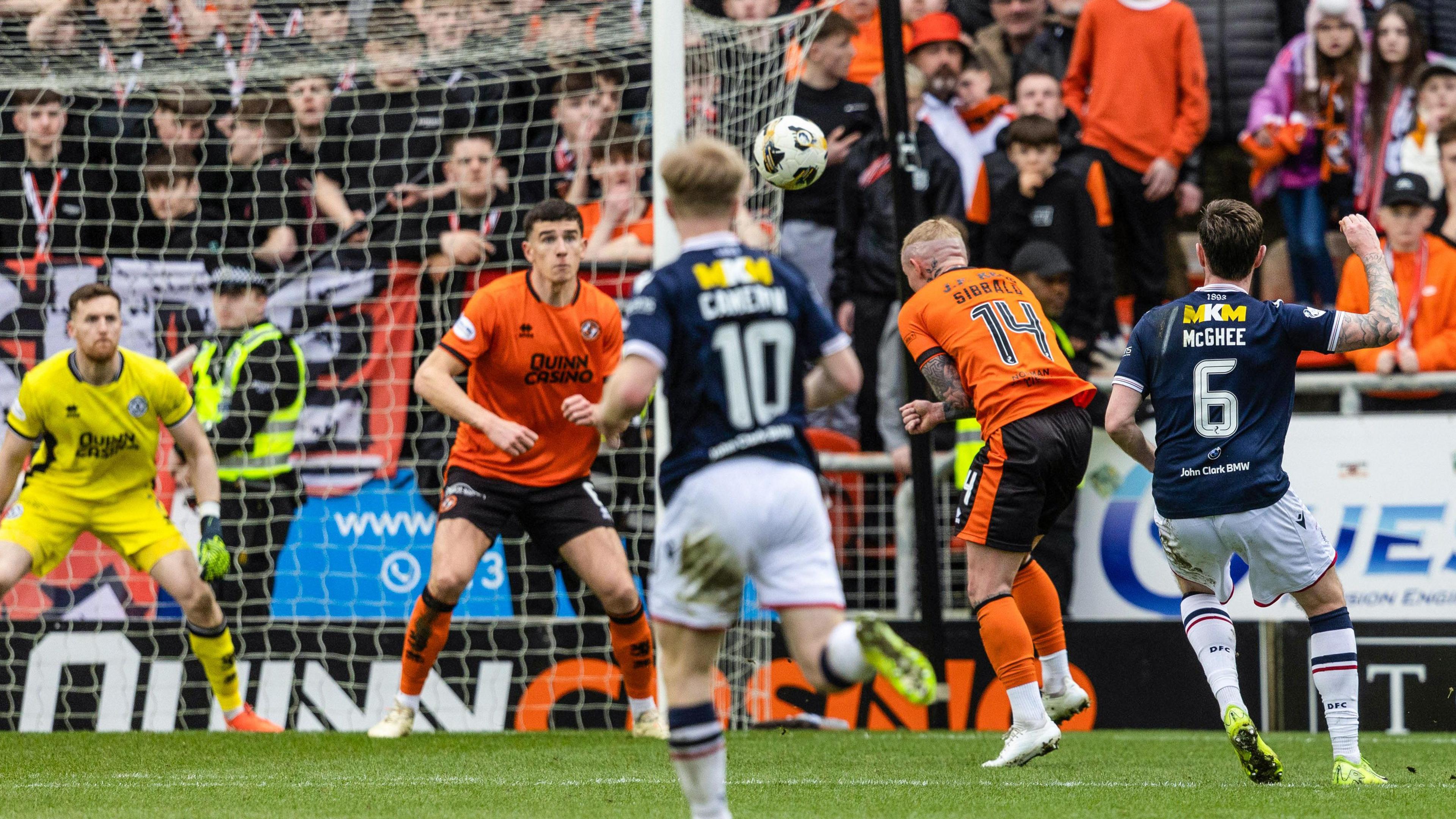 Jordan McGhee curls home his second and Dundee's third goal of the derby