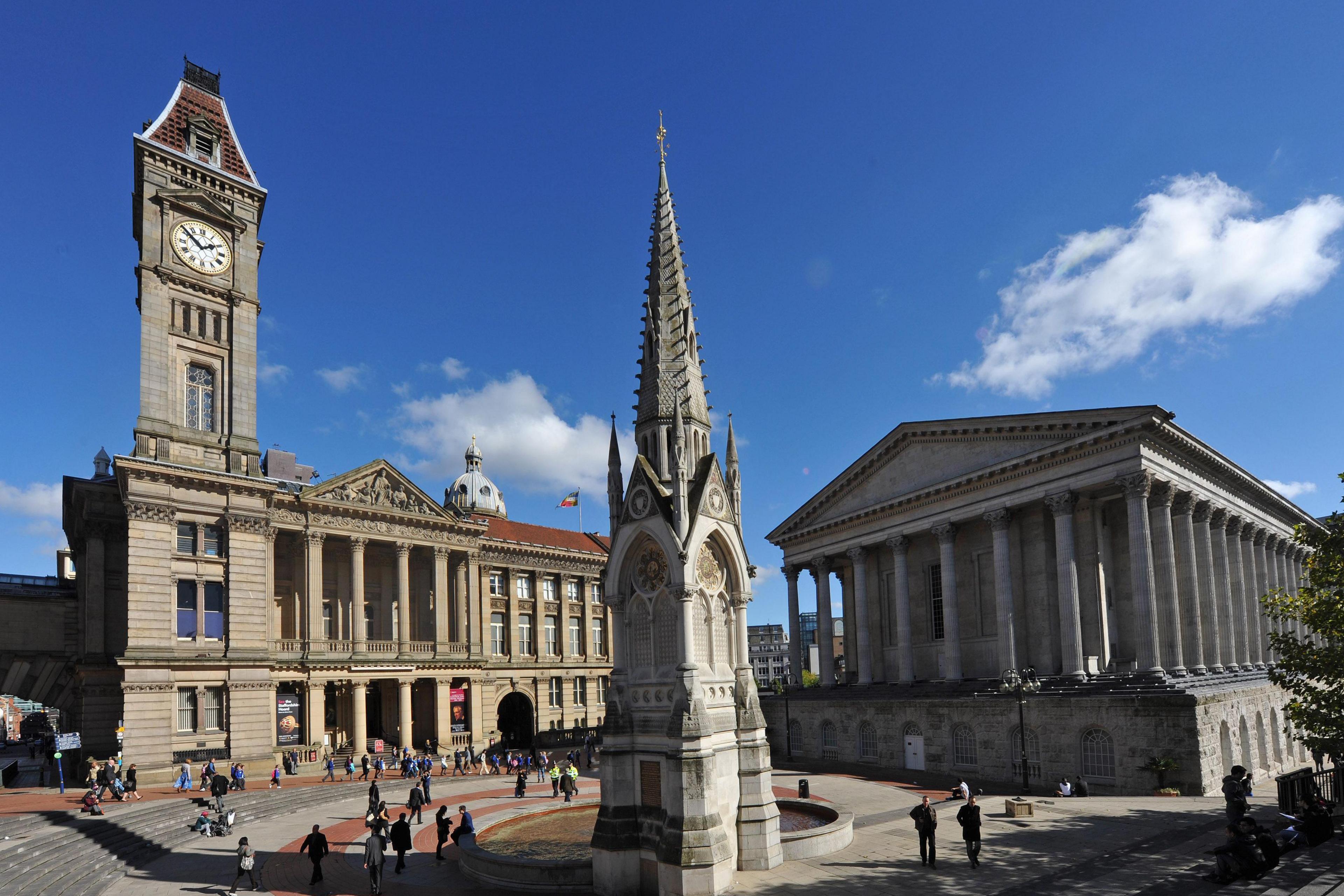 General view of Chamberlain Square in Birmingham. On the left can be seen the Birmingham City Museum & Art Gallery and on the right can be seen the Town Hall. In the foreground can be seen the Chamberlain Memorial.