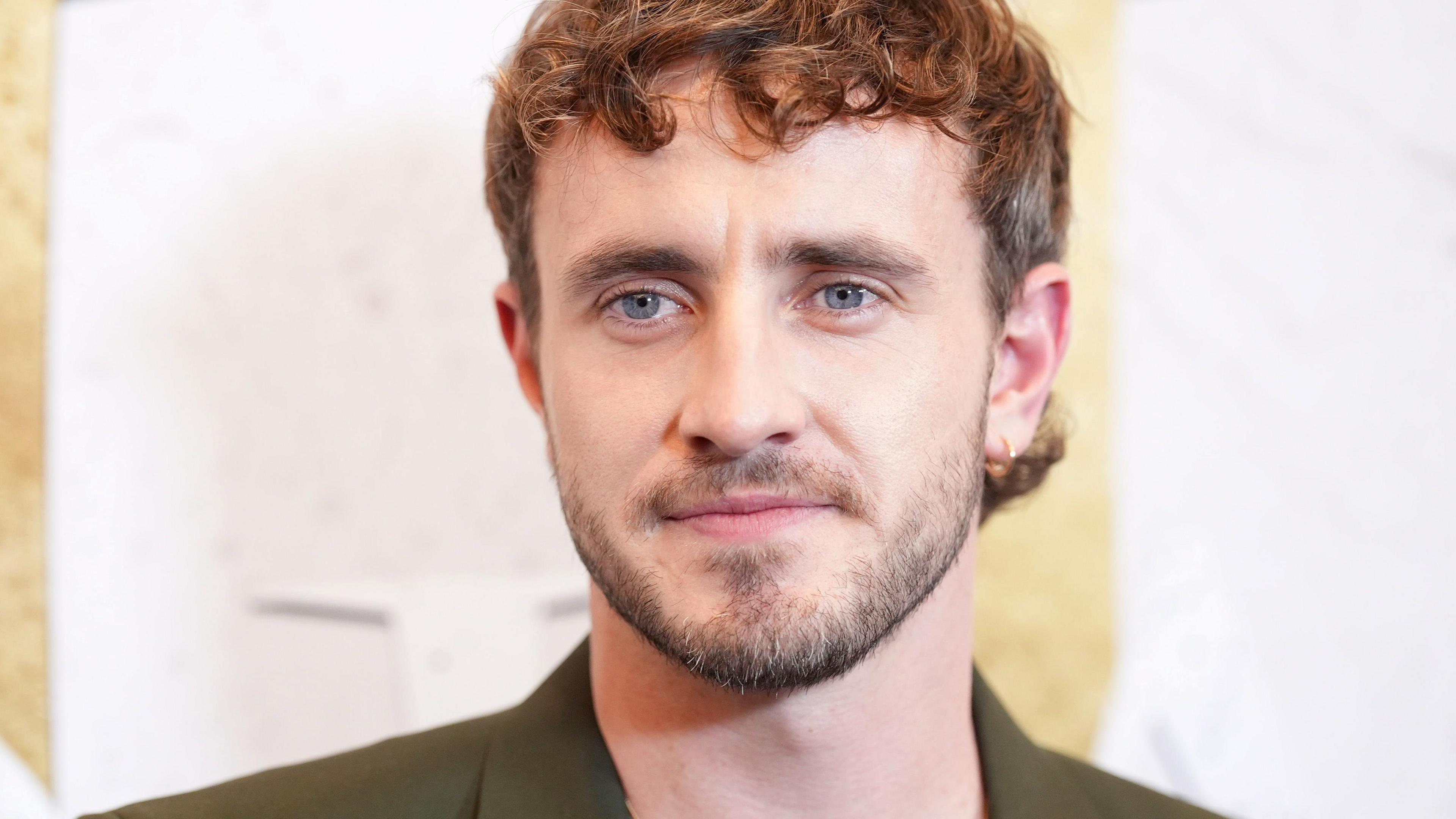 Irish actor Paul Mescal is pictured in a headshot looking slightly off camera.