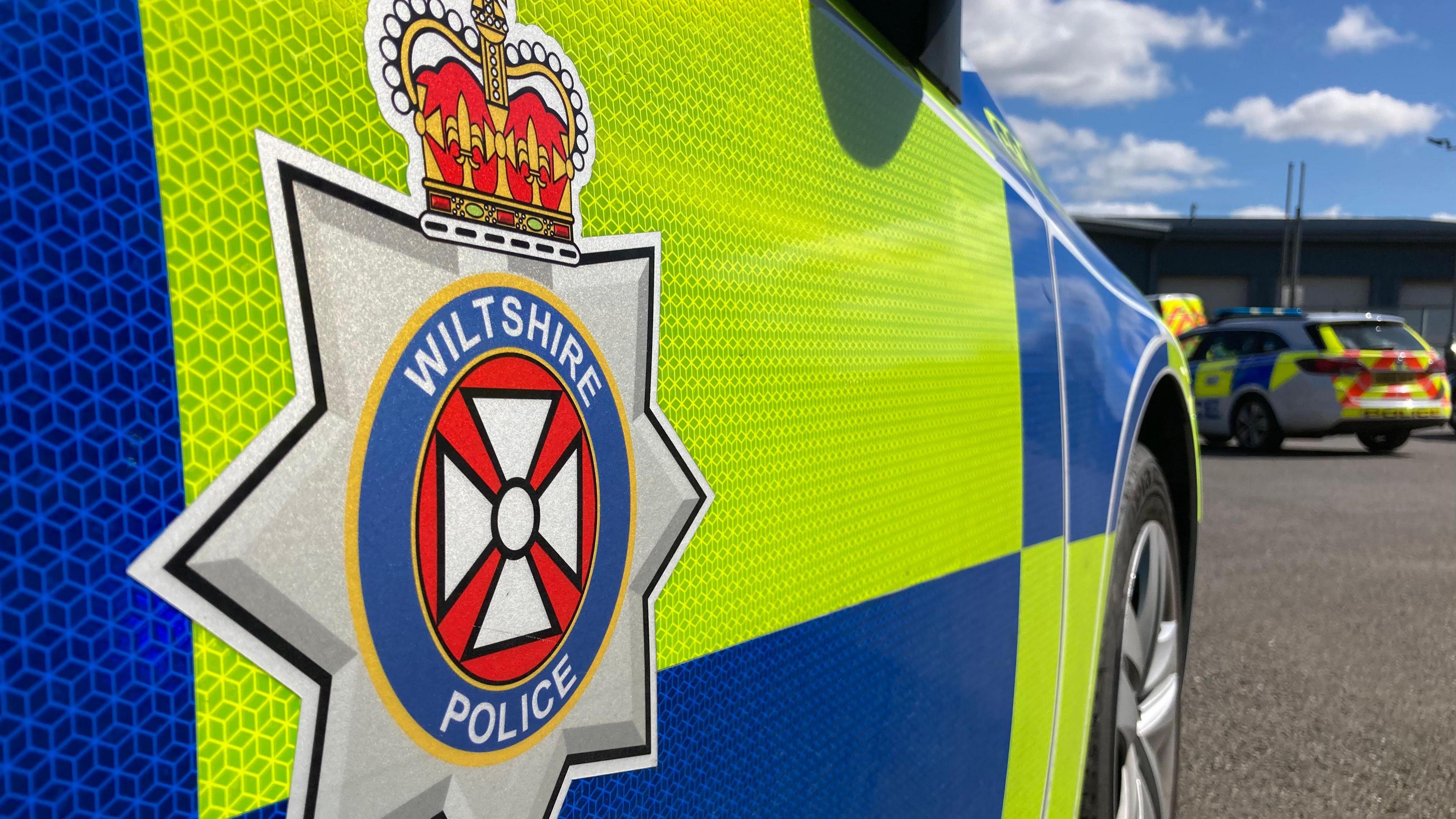 The generic side of a Wiltshire Police car - a close-up with the force logo