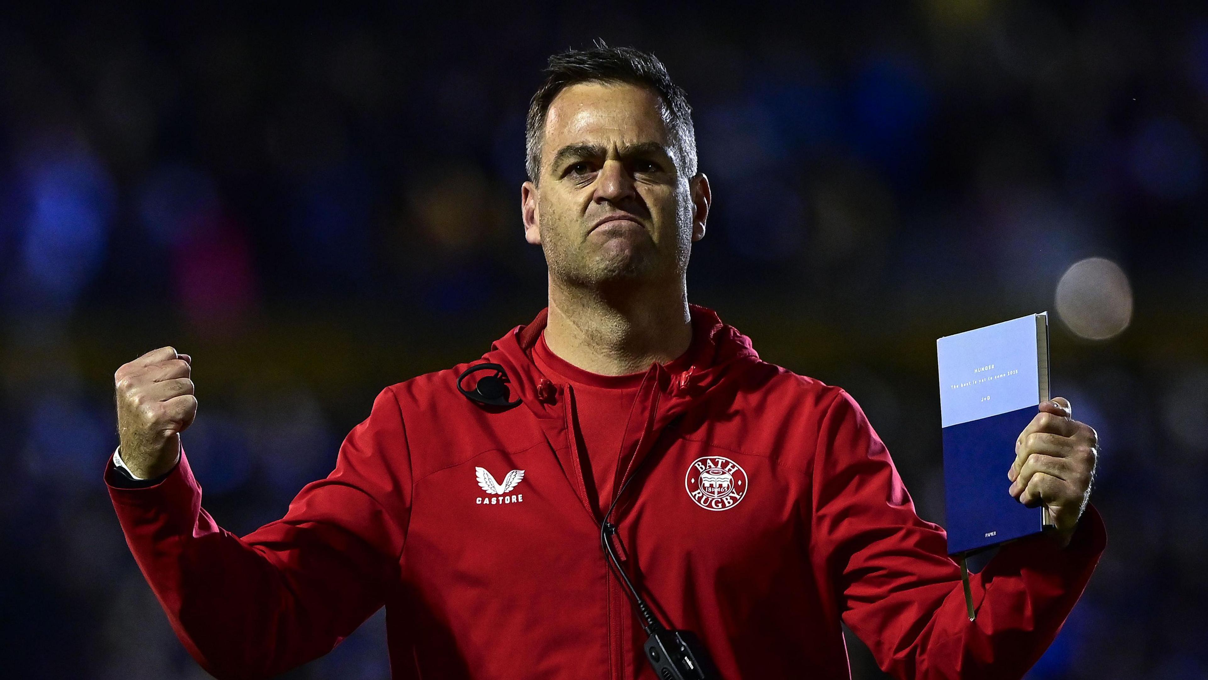 Johann van Graan clenches his fists in celebration to fans at the final whistle
