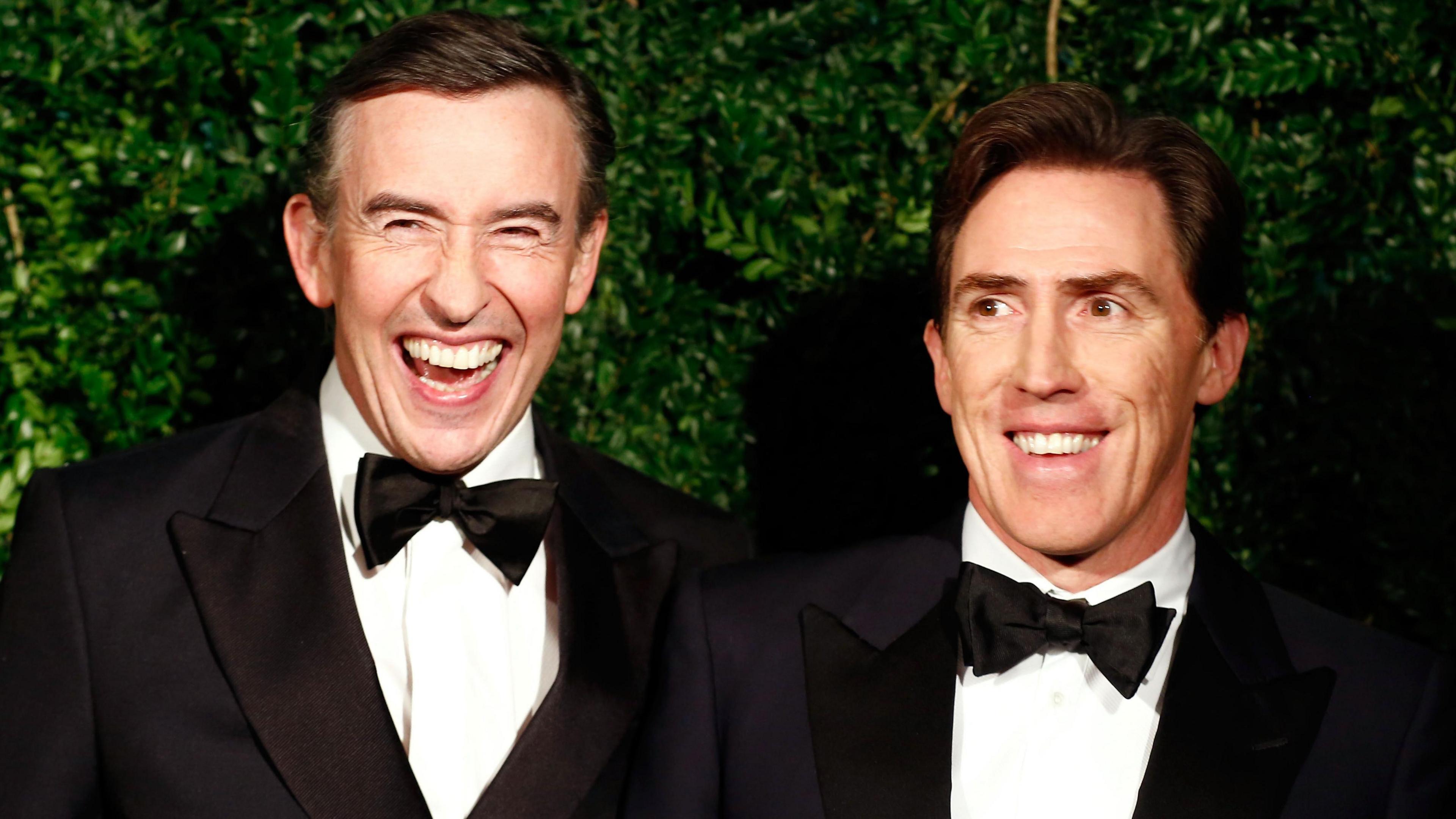 Steve Coogan and Rob Brydon having a laugh while dressed smartly at an awards ceremony in 2014