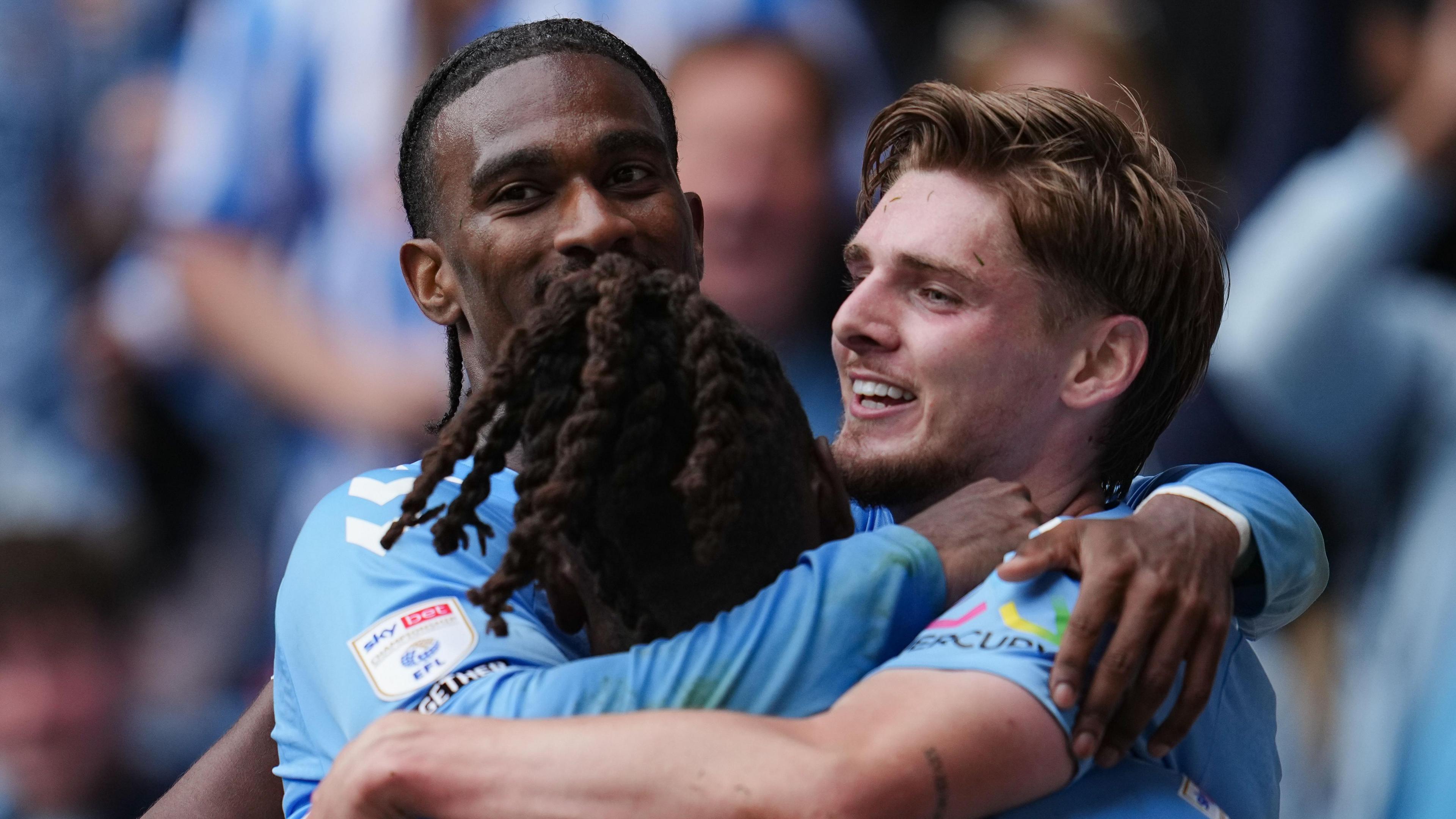 Jack Rudoni celebrates his second goal with Haji Wright and Brandon Thomas-Asante