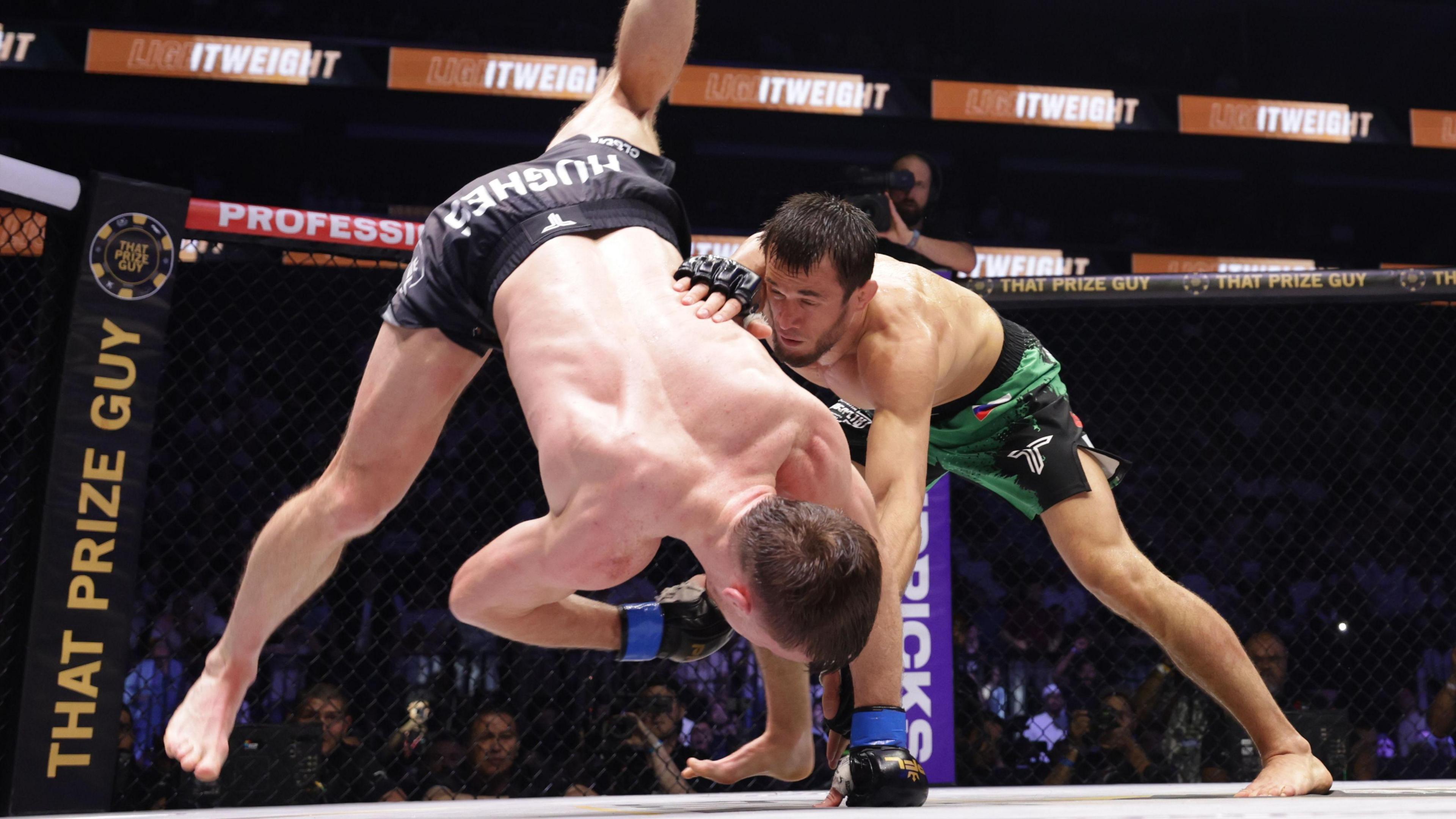 Paul Hughes is airborn as Usman Nurmagomedov tries to grab him