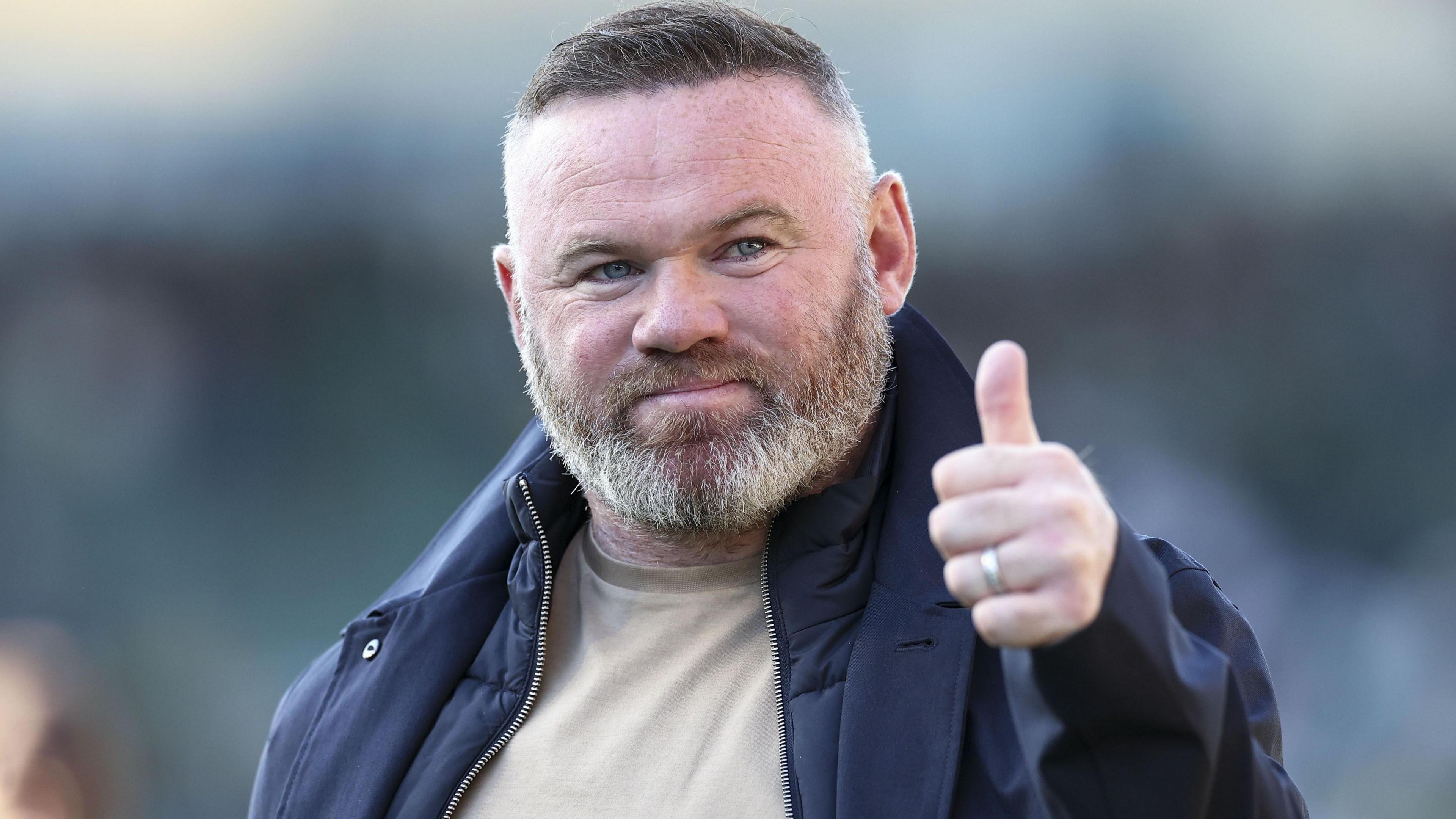 Wayne Rooney gives a thumbs up to Plymouth fans