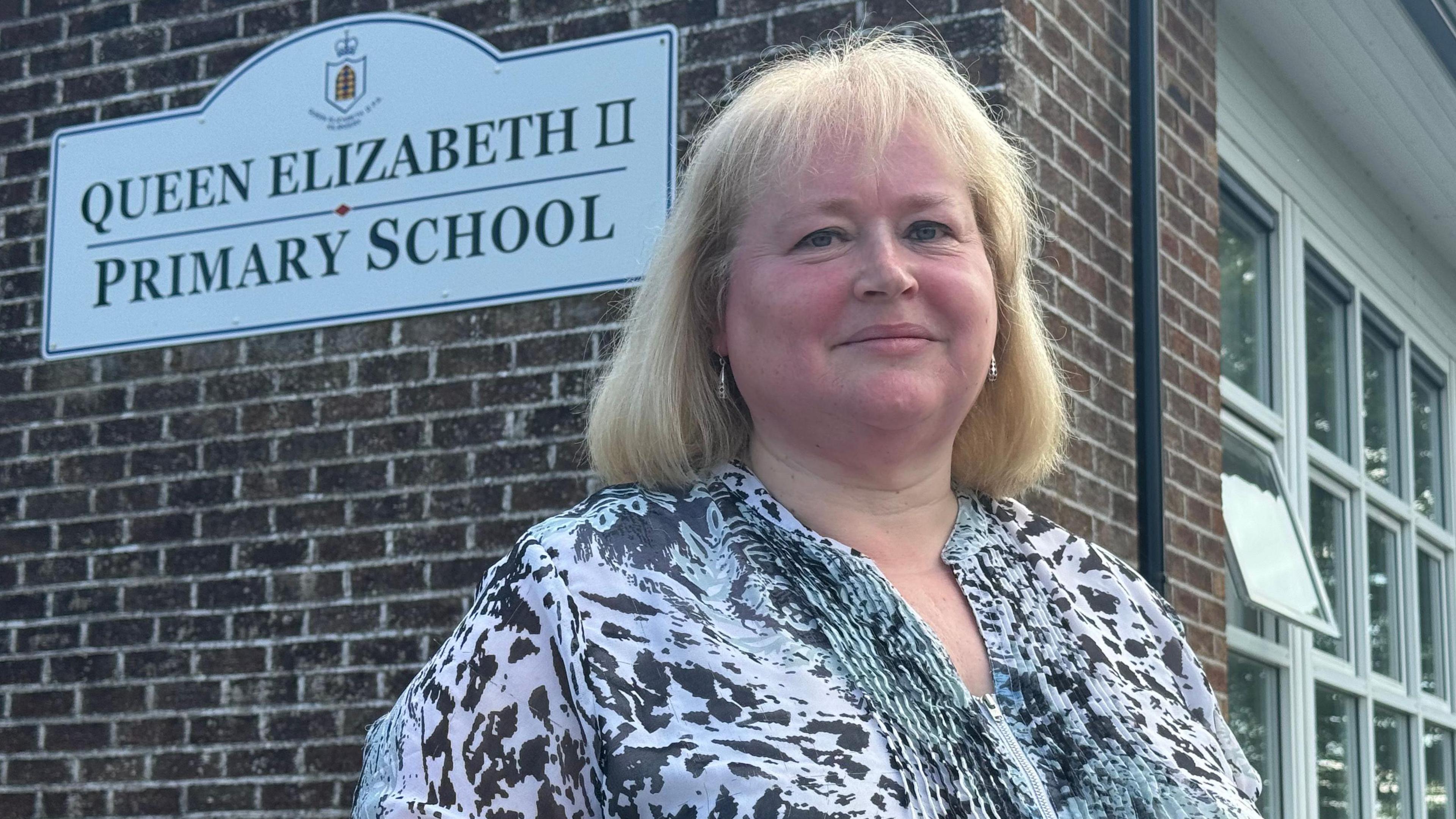 Joyce Clingan outside the school