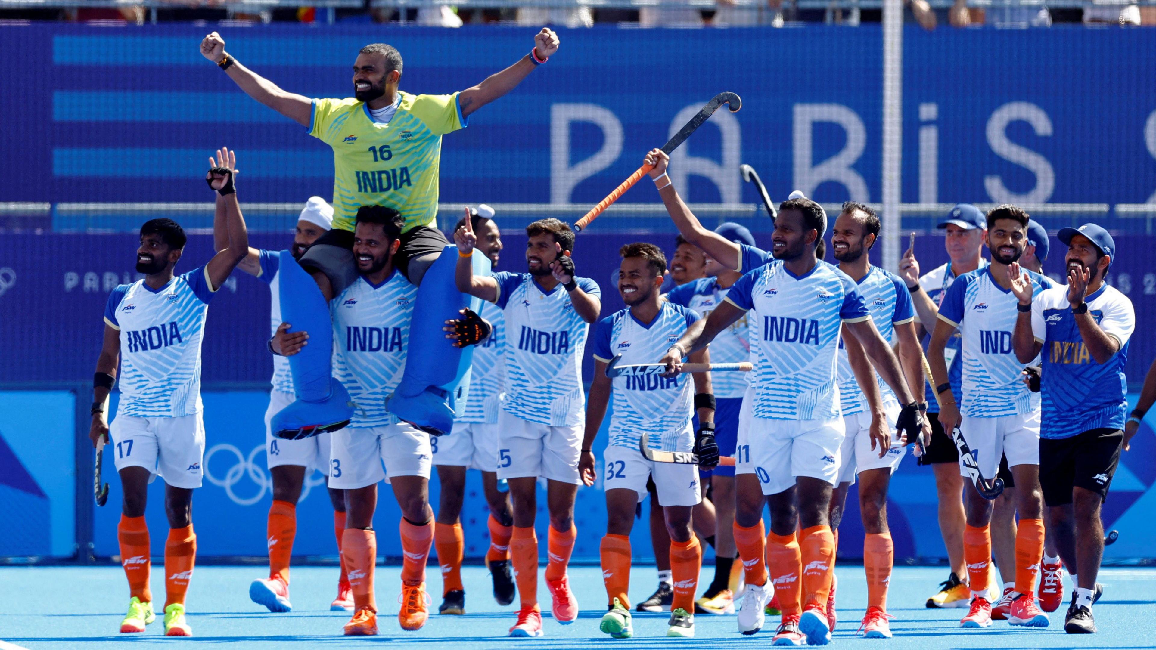 Paris 2024 Olympics - Hockey - Men's Bronze Medal Match - India vs Spain - Yves-du-Manoir Stadium, Colombes, France - August 08, 2024. Sreejesh Parattu Raveendran of India, Harmanpreet Singh of India, Vivek Sagar Prasad of India and Sumit Sumit of India celebrate with teammates winning the match. REUTERS/Anushree Fadnavis TPX IMAGES OF THE DAY