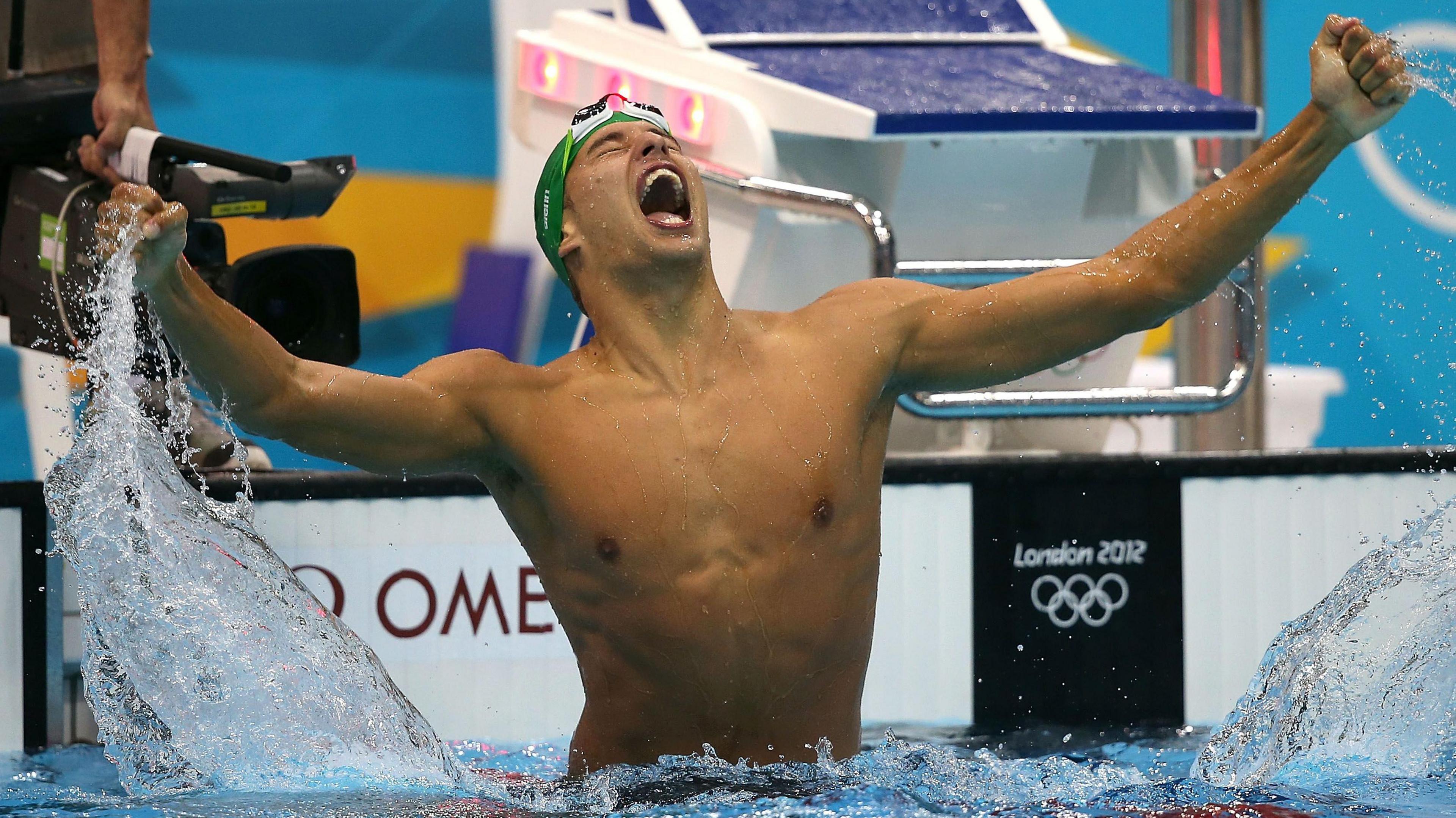 Le Clos roars with delight in the pool after winning Olympic gold.