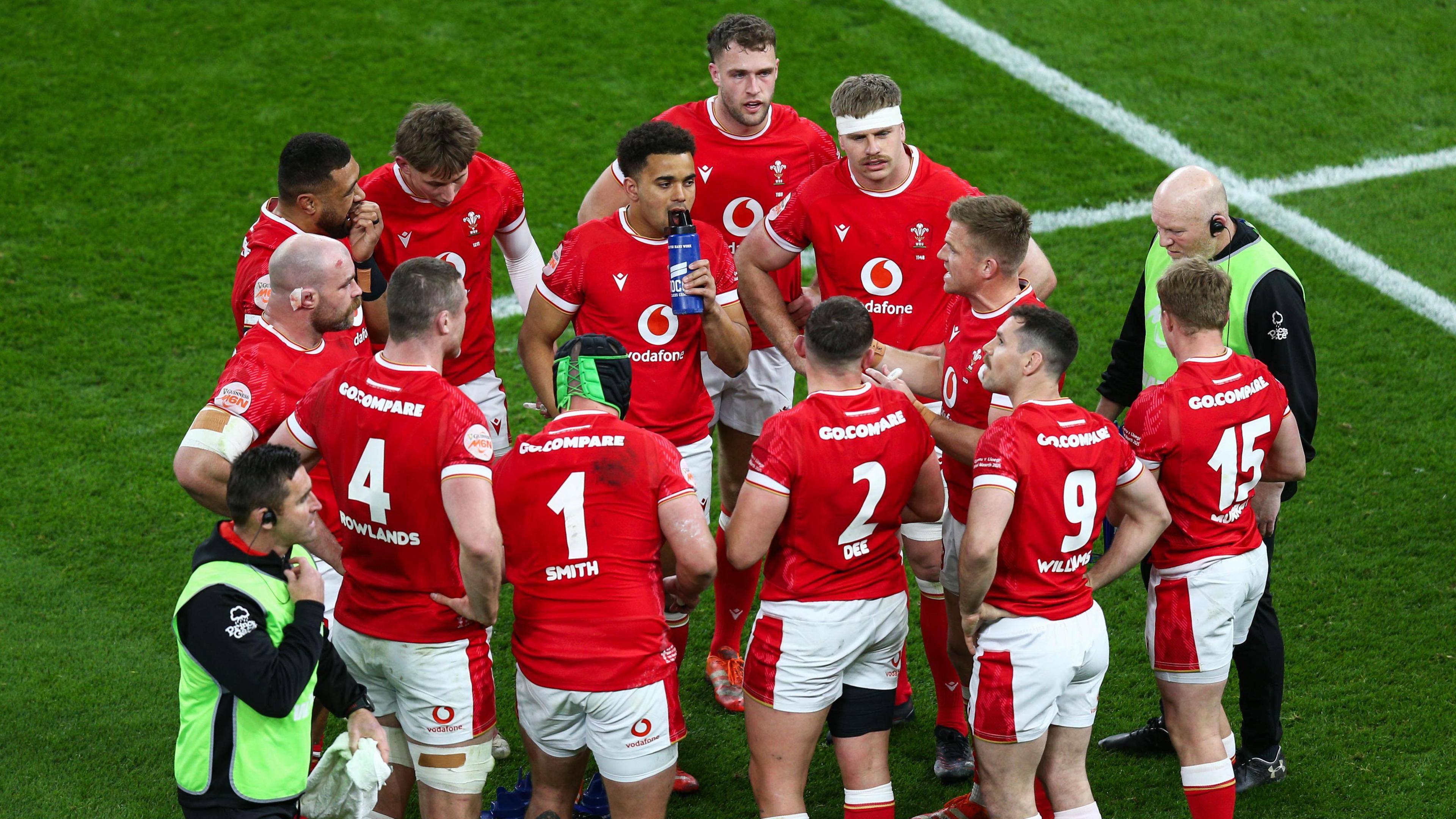 Wales players in a huddle in the defeat against England