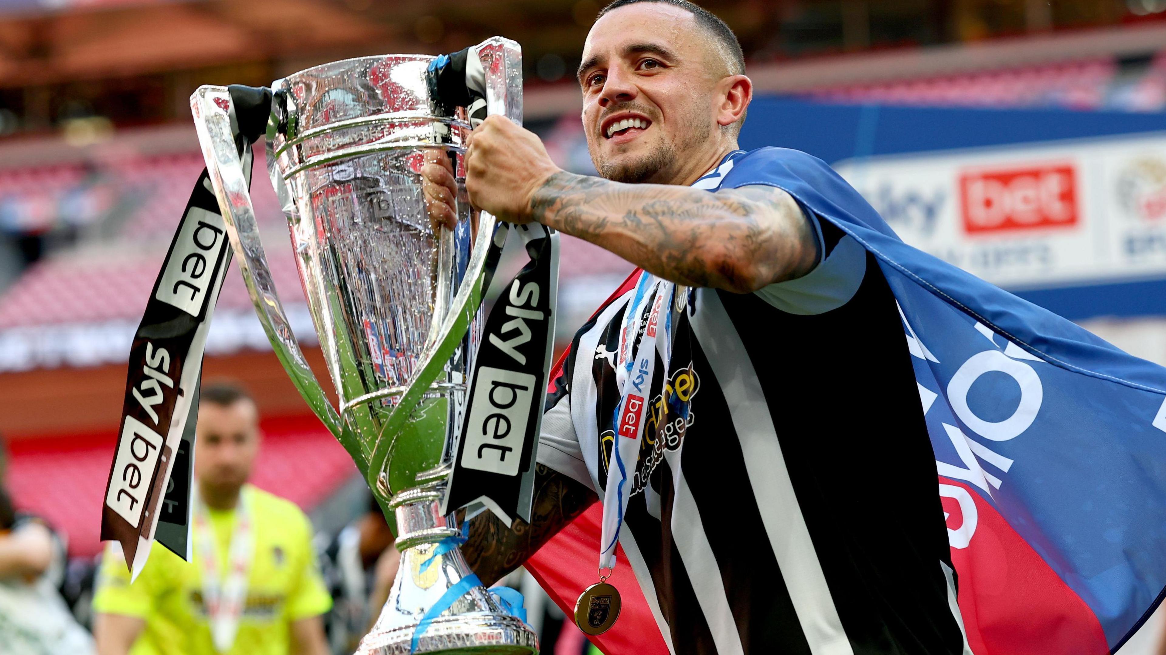 Oliver Norburn celebrates promotion to League One with Notts County