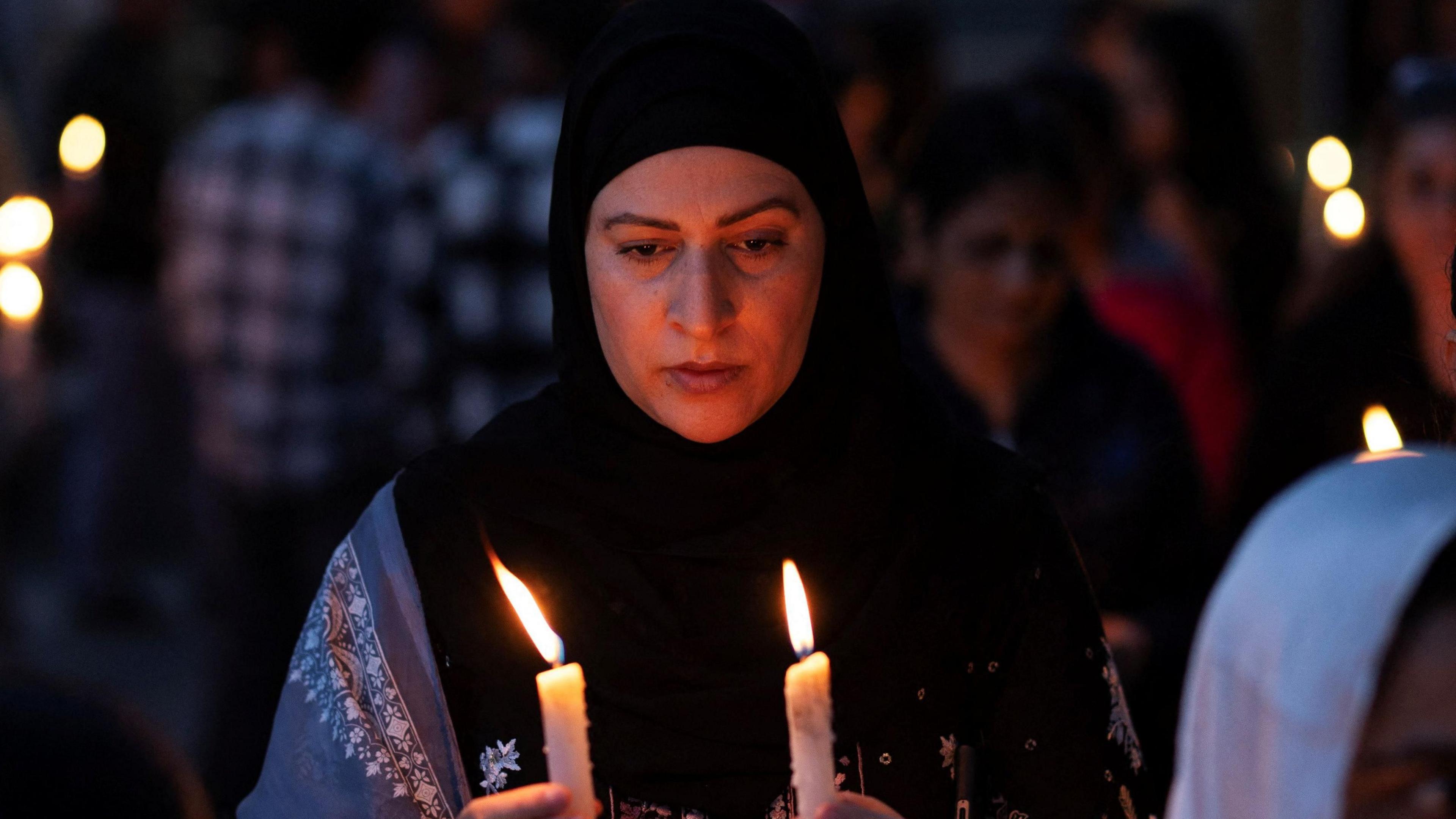 A demonstrator holds candles during a candle light vigil to condemn a suspected militant attack on tourists near south Kashmir’s scenic Pahalgam, in Srinagar April 23, 2025. REUTERS/Adnan Abidi
