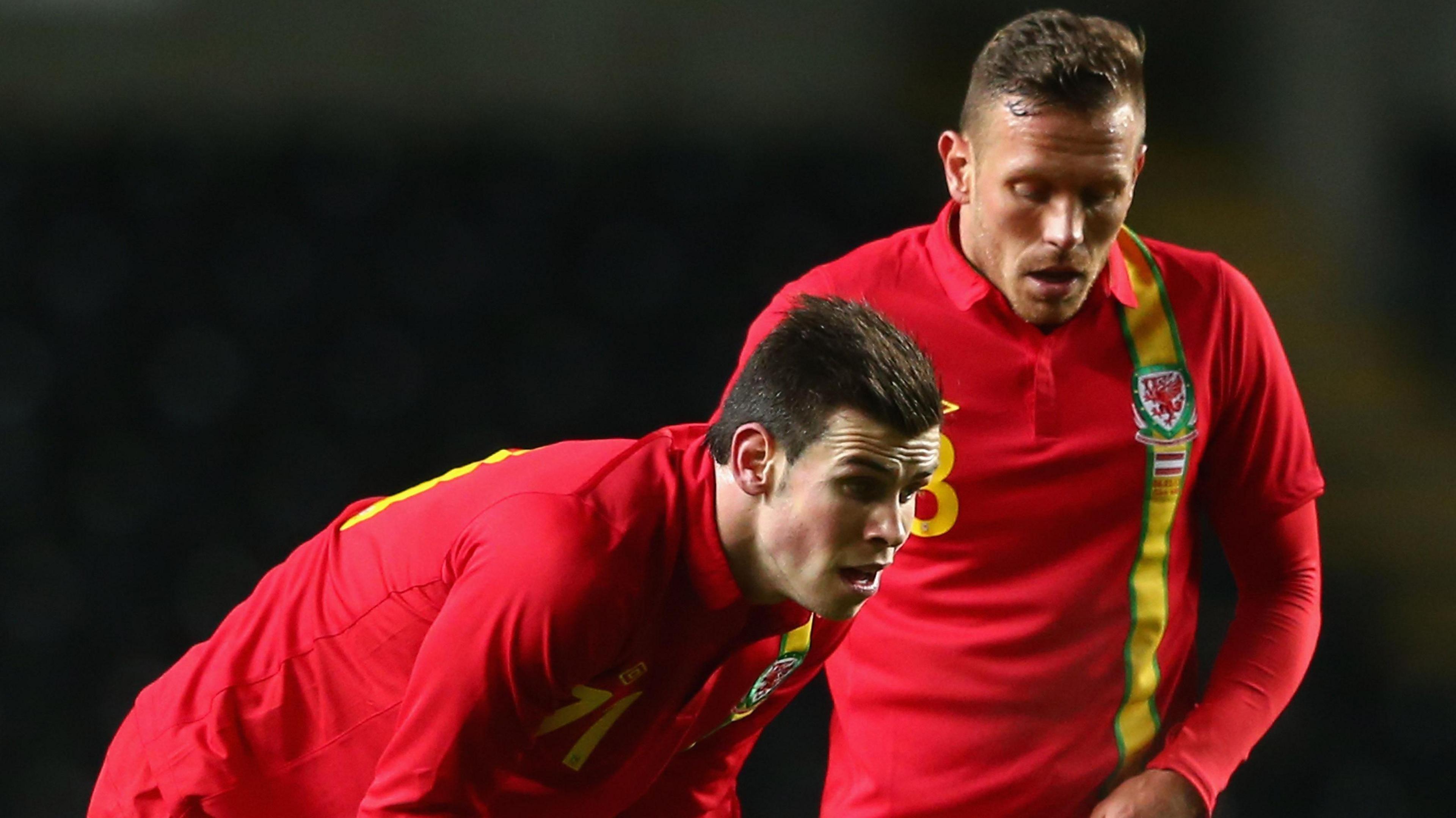 Gareth Bale (L) and Craig Bellamy in action for Wales in 2013