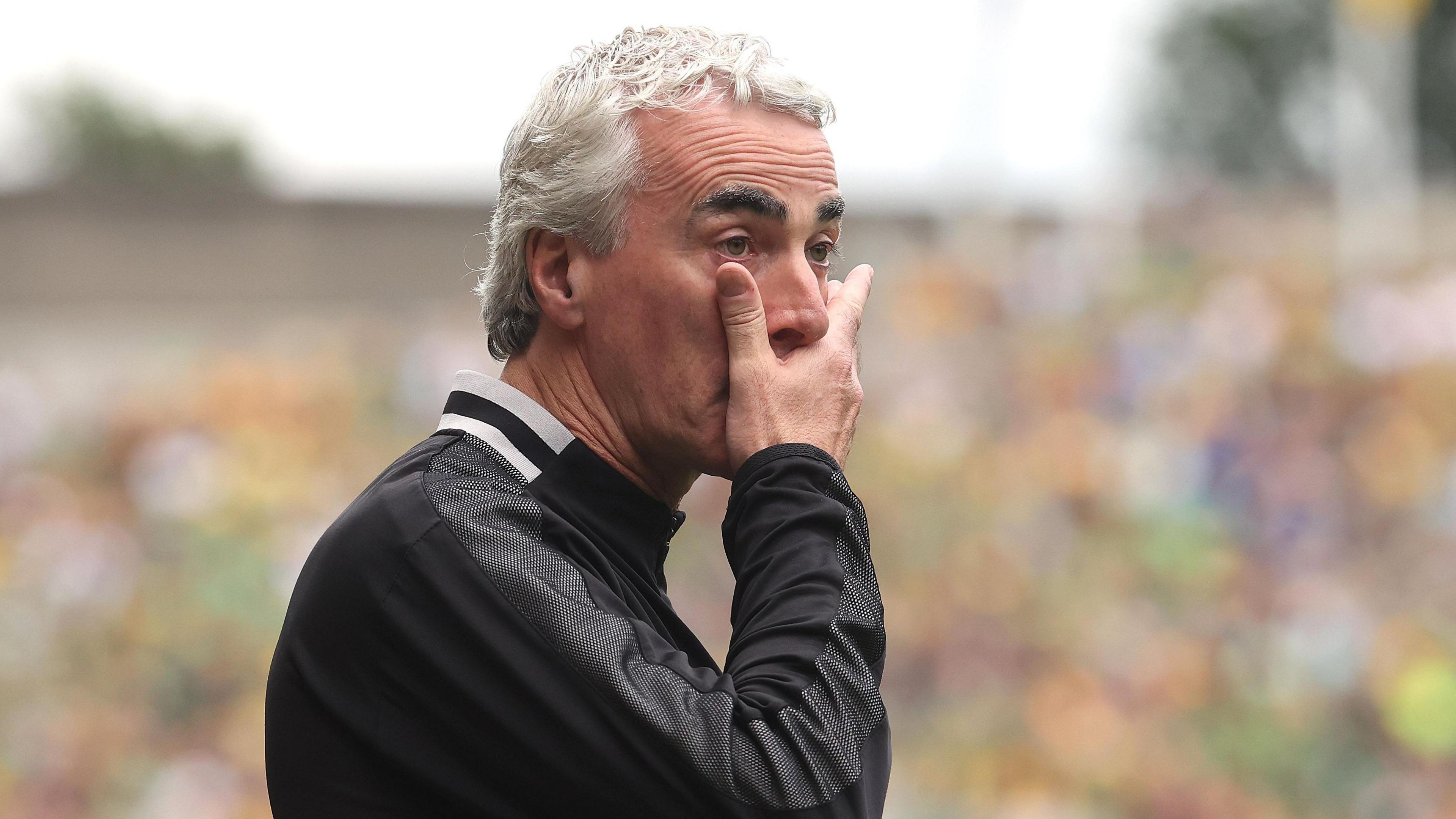 Jim McGuinness dejected connected nan sideline