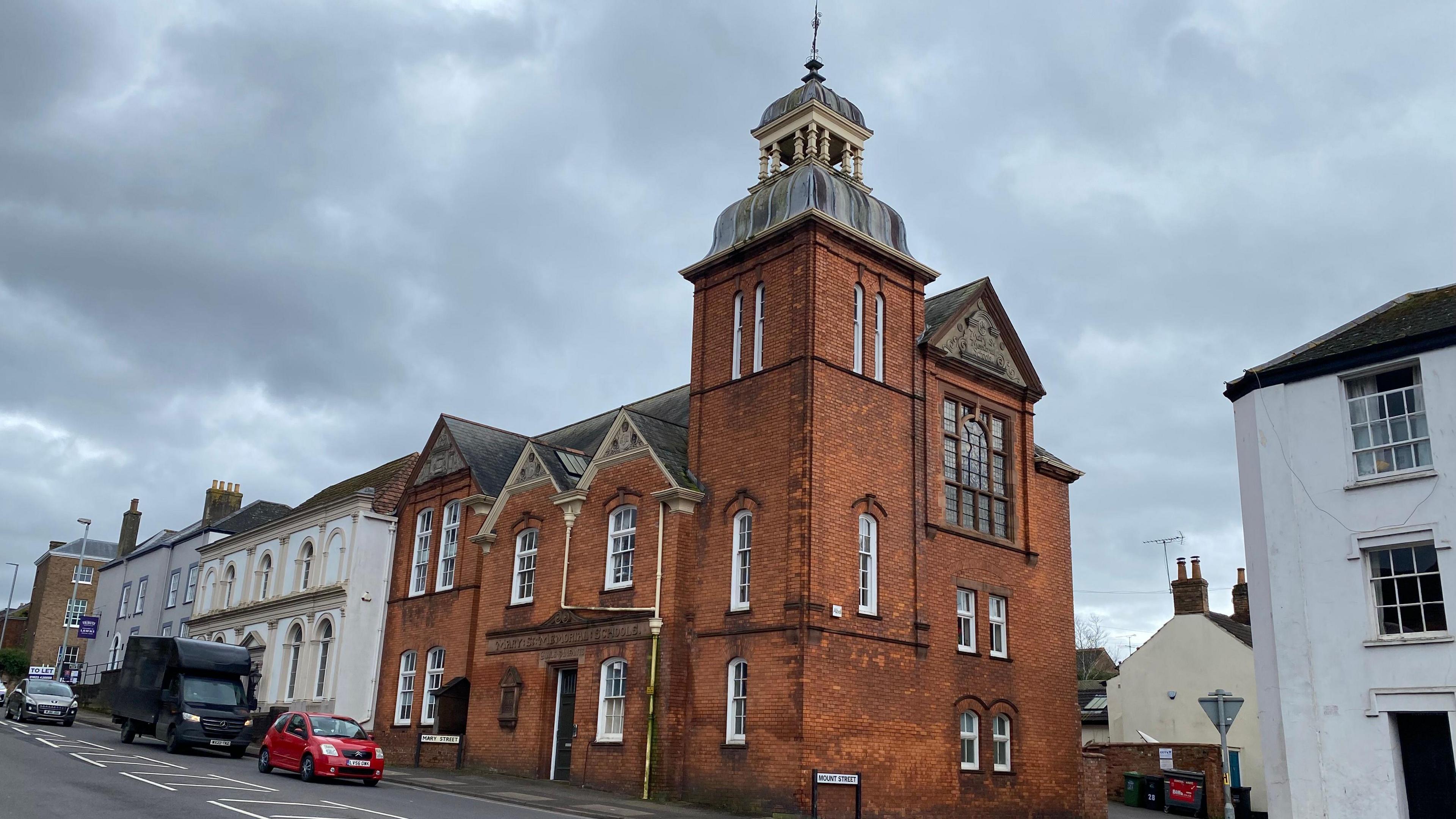 The exterior of the Open Door building, with its red brick exterior