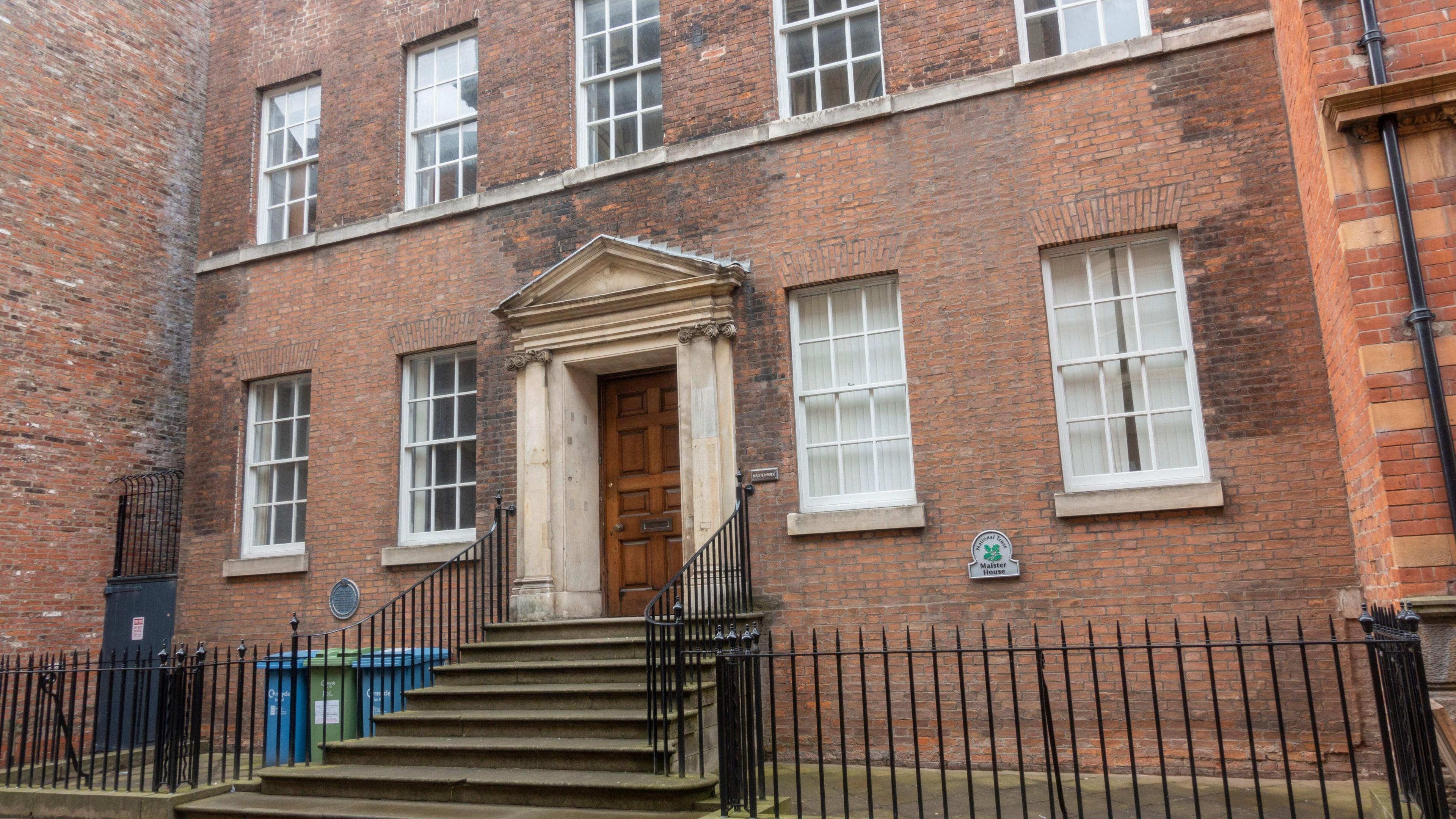 Maister House - a historic Georgian-style brick building with a grand stone portico entrance and symmetrical sash windows.