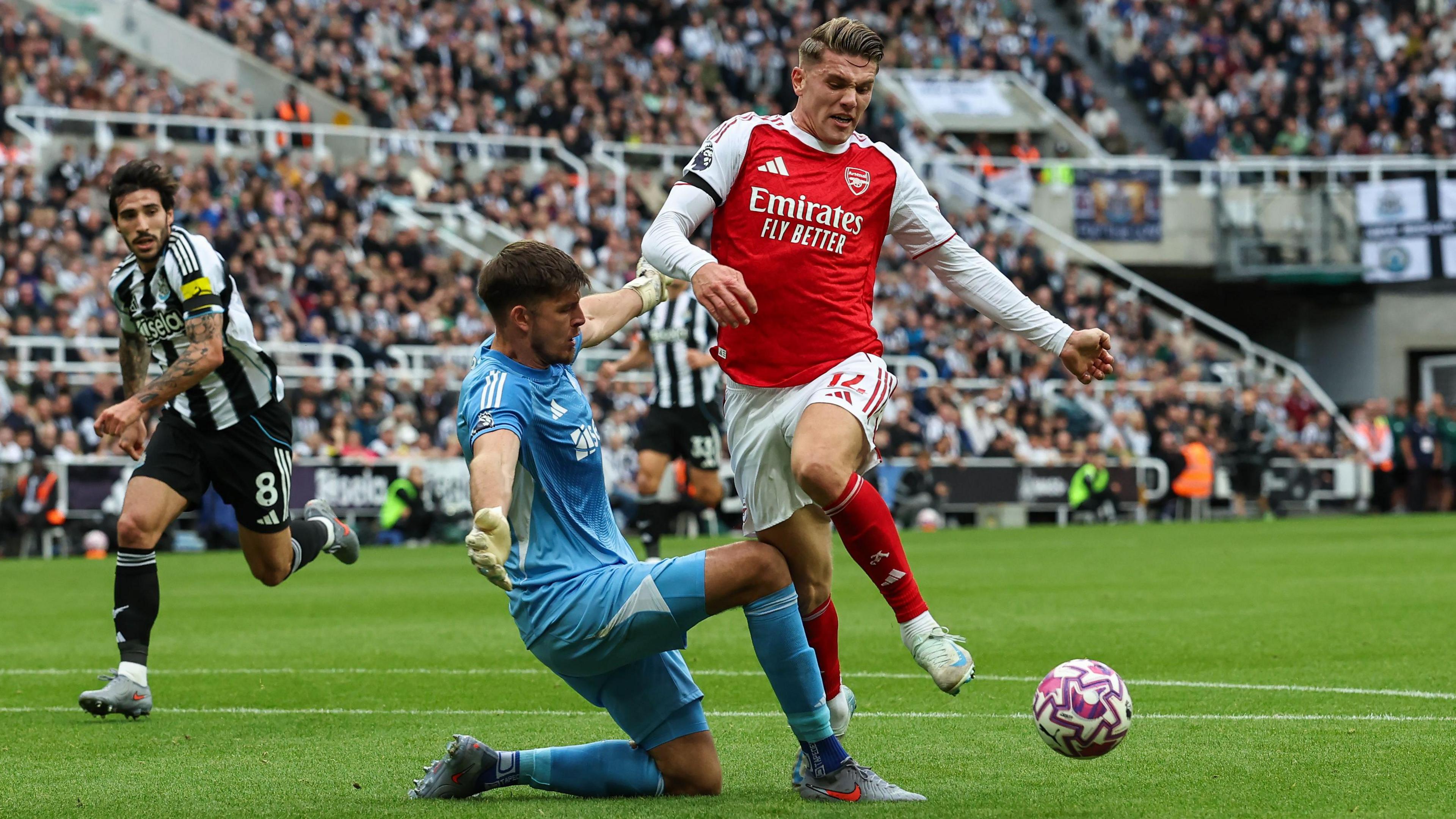 Newcastle goalkeeper Nick Pope challenges Arsenal striker Viktor Gyokeres in the Premier League at St James' Park
