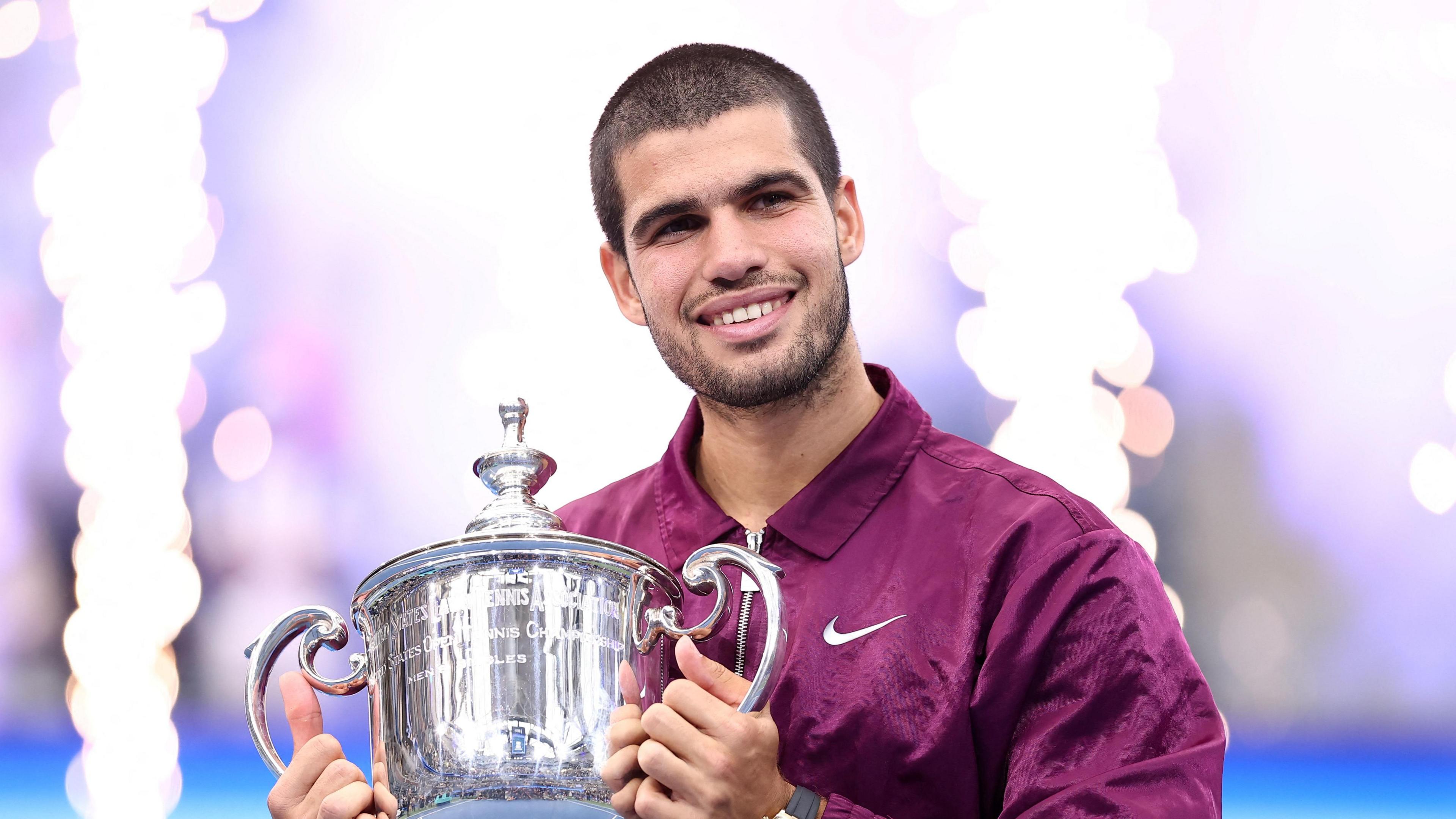 Carlos Alcaraz lifts the US Open trophy