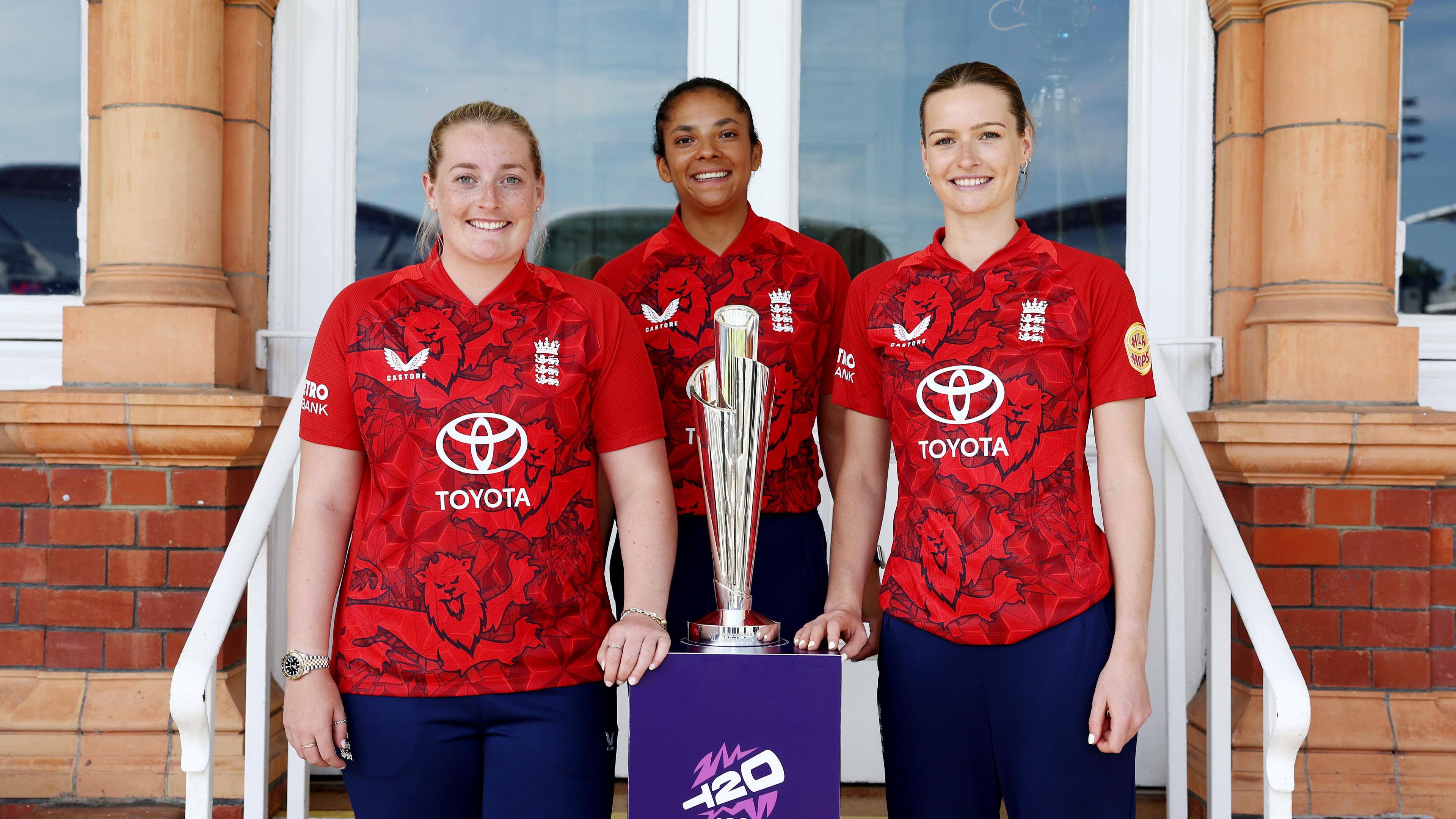 Sophie Ecclestone, Sophia Dunkley and Lauren Bell pose with T20 World Cup trophy at launch event