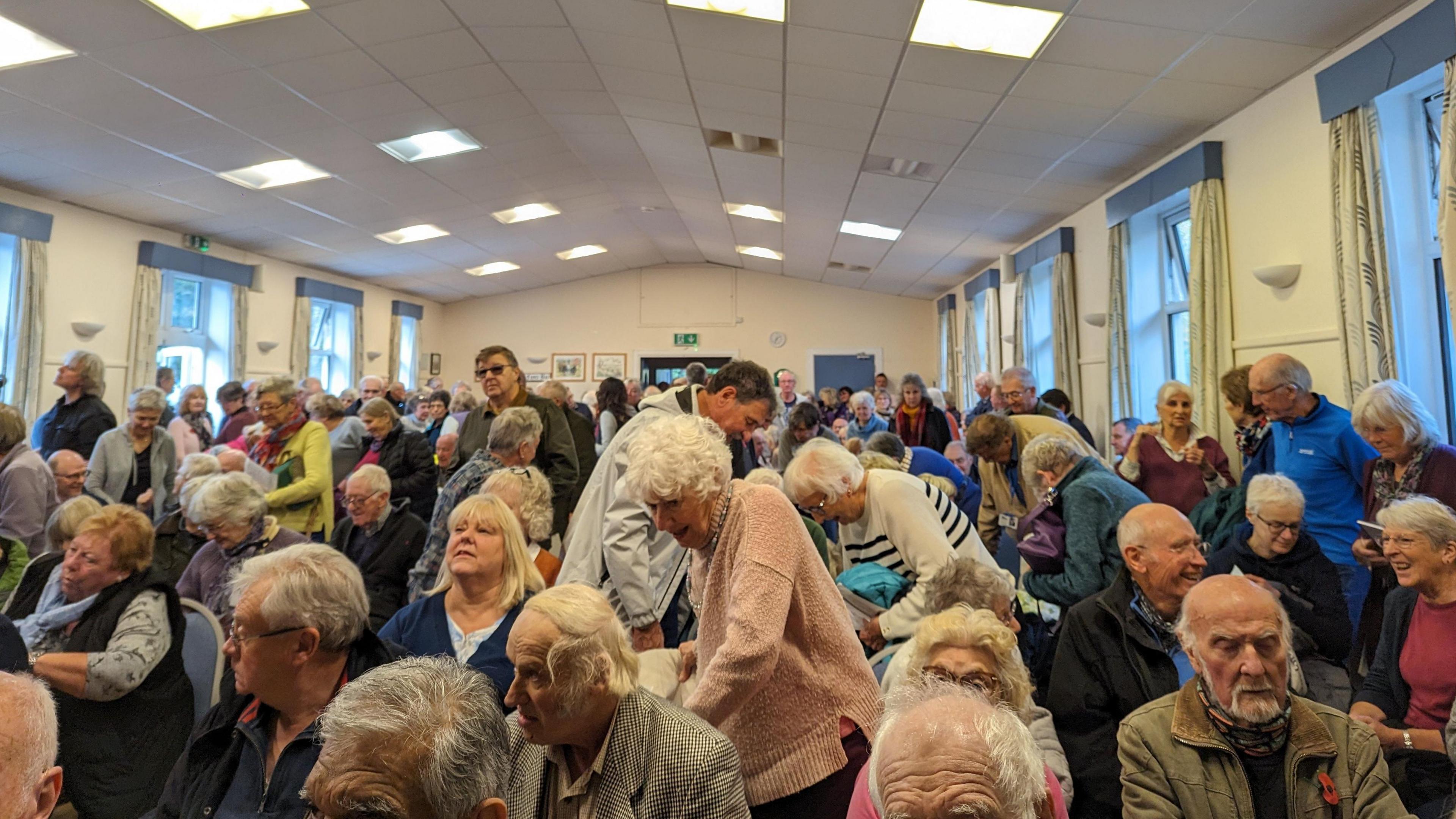 Attendees arriving at a meeting