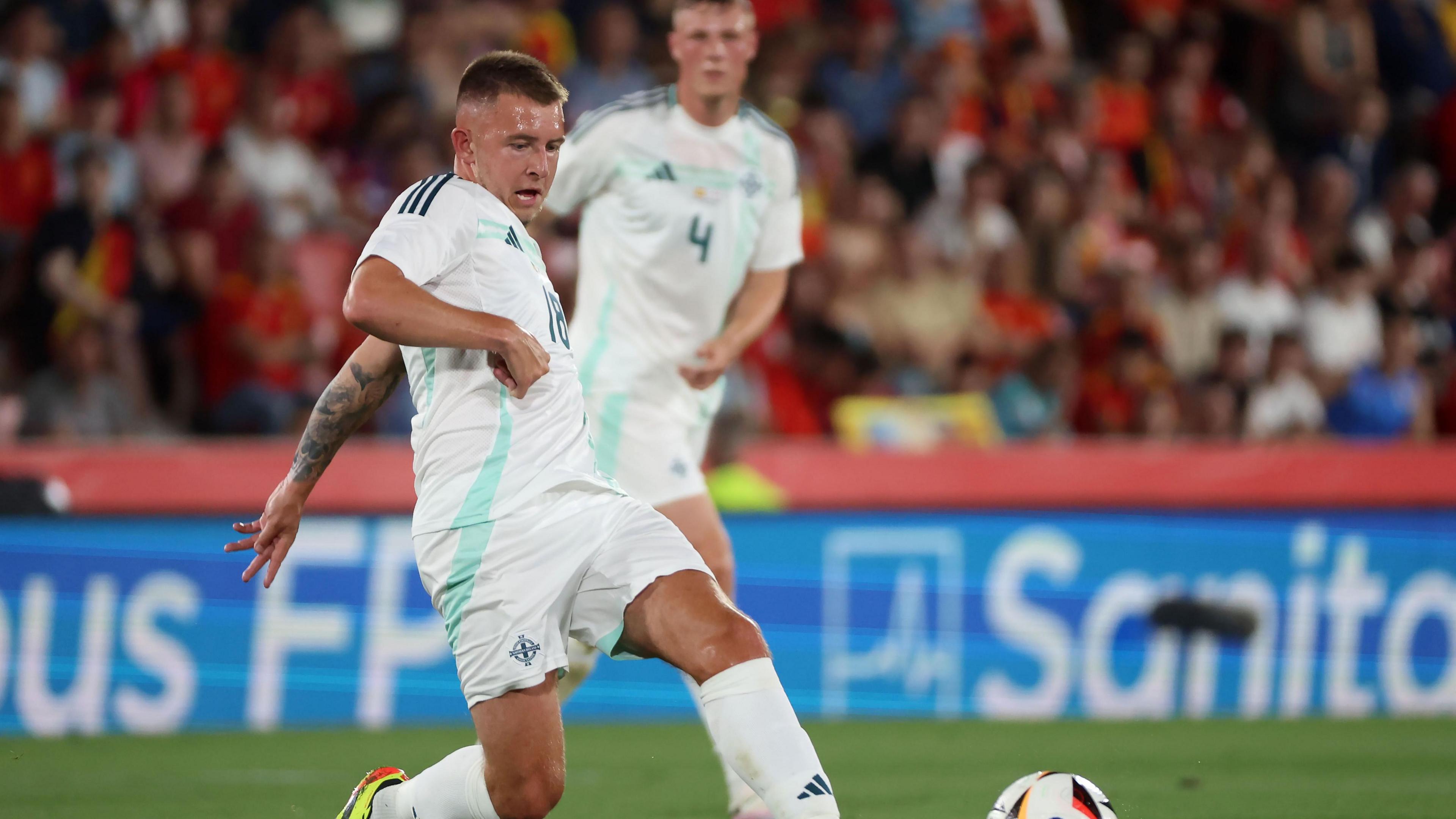 Boyd-Munce passing the ball against Spain