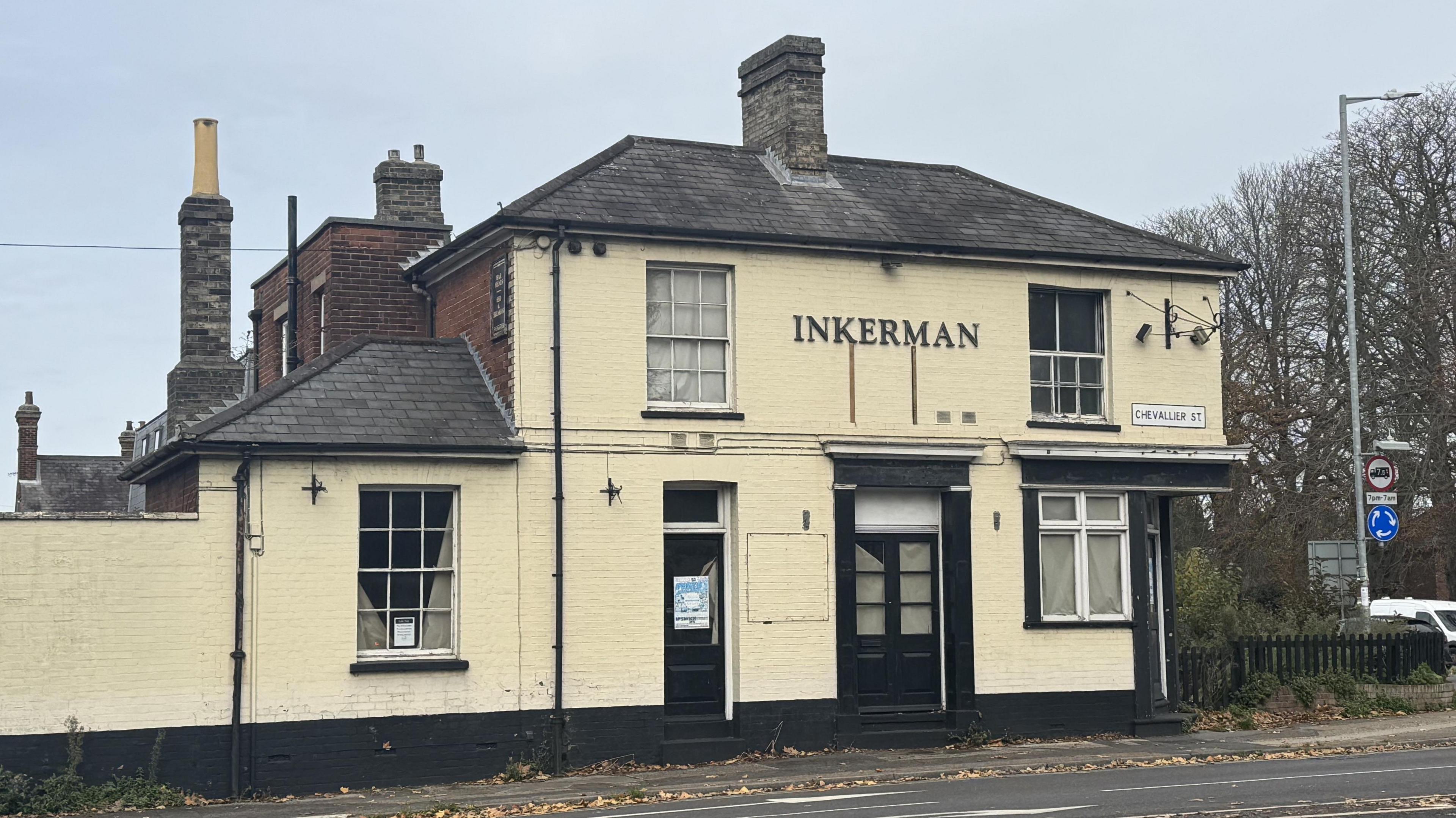 A photo of The Inkerman pub building taken from the opposite side of the road. The cream building is closed up with little sign of life.
