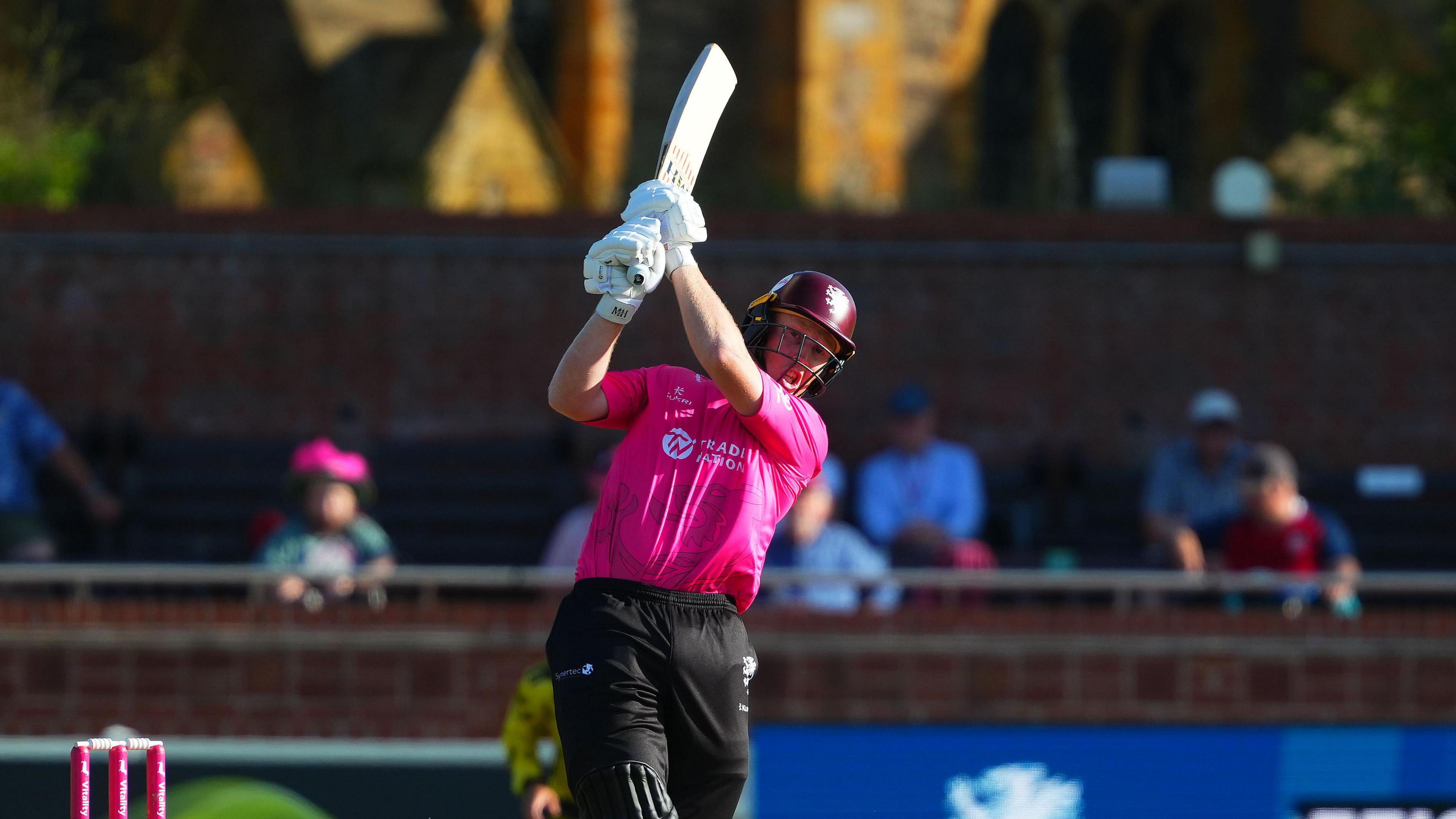 Somerset's James Rew hitting a shot down the ground.