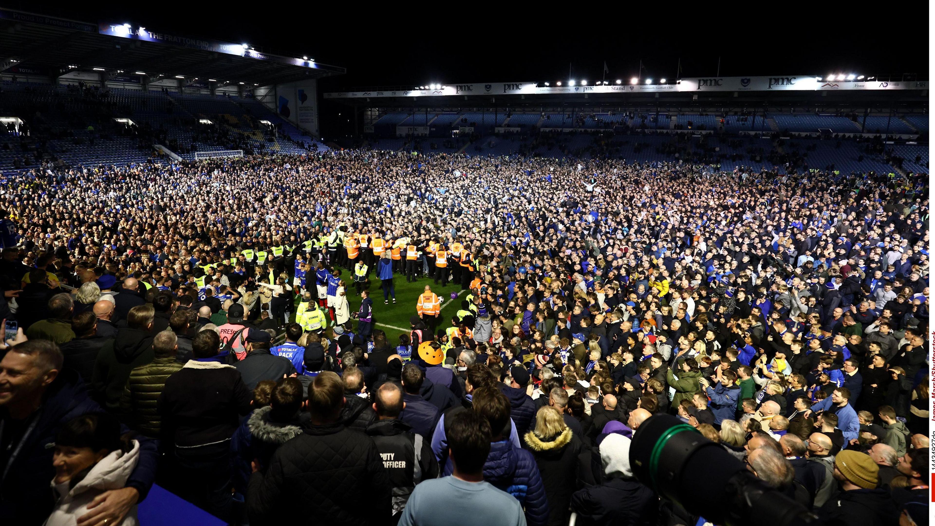 Fans on the pitch at Portsmouth