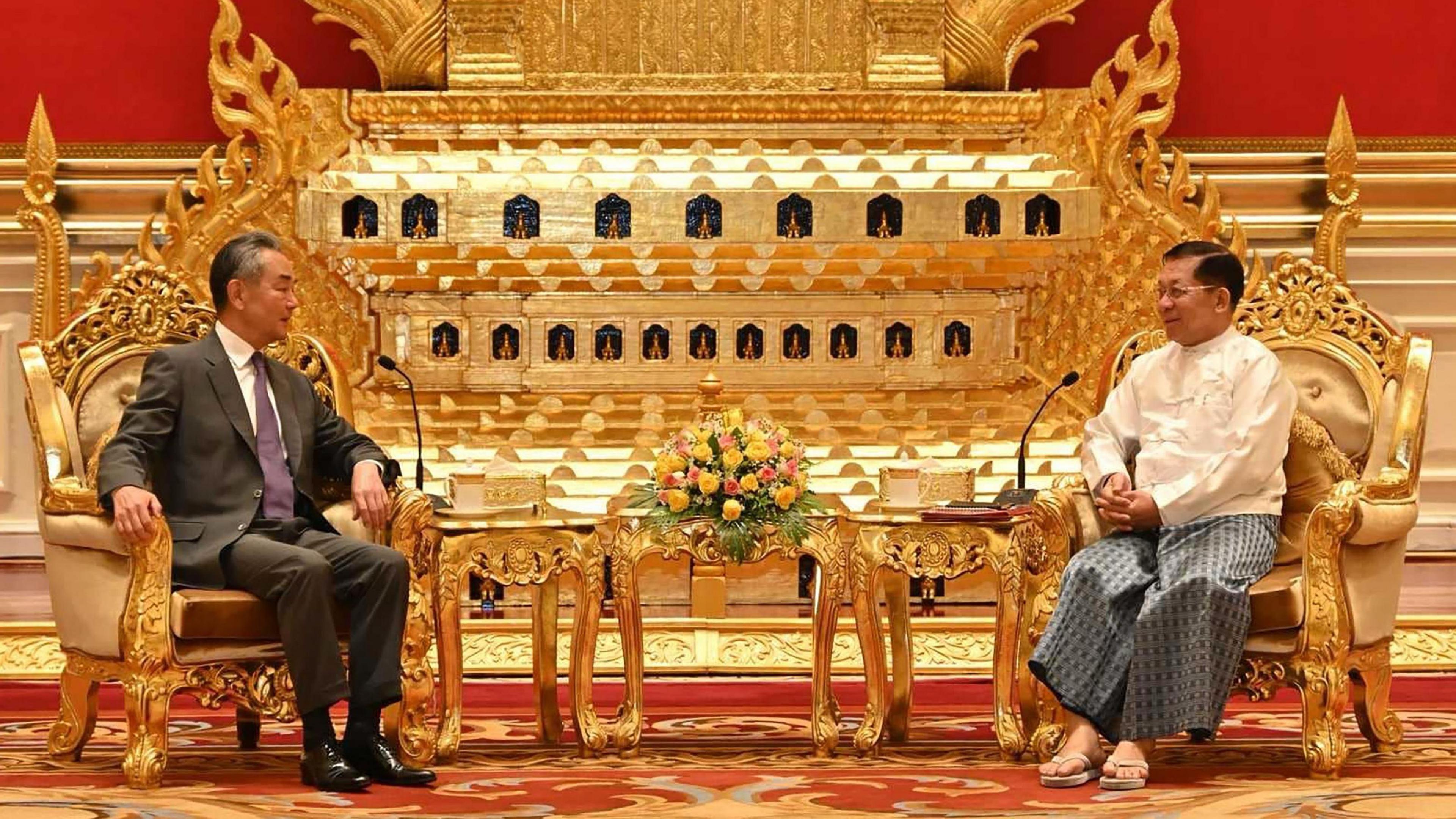 A handout photo made available by the Myanmar military information team shows Senior General Min Aung Hlaing (R) and Chinese Foreign Minister Wang Yi (L) during their meeting in Naypyitaw, Myanmar, 14 August 2024.