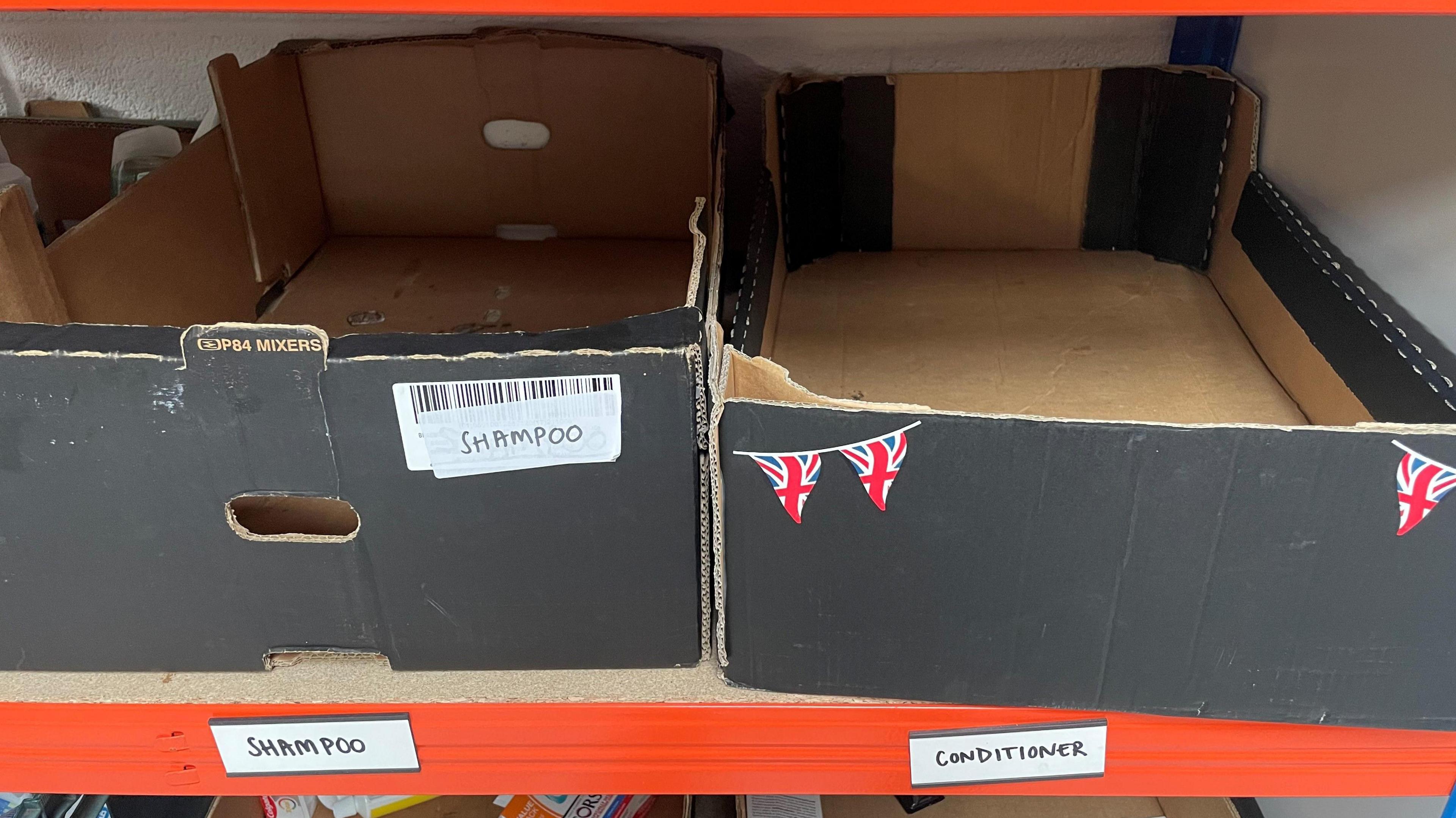 Empty boxes labelled 'shampoo' and 'conditioner'