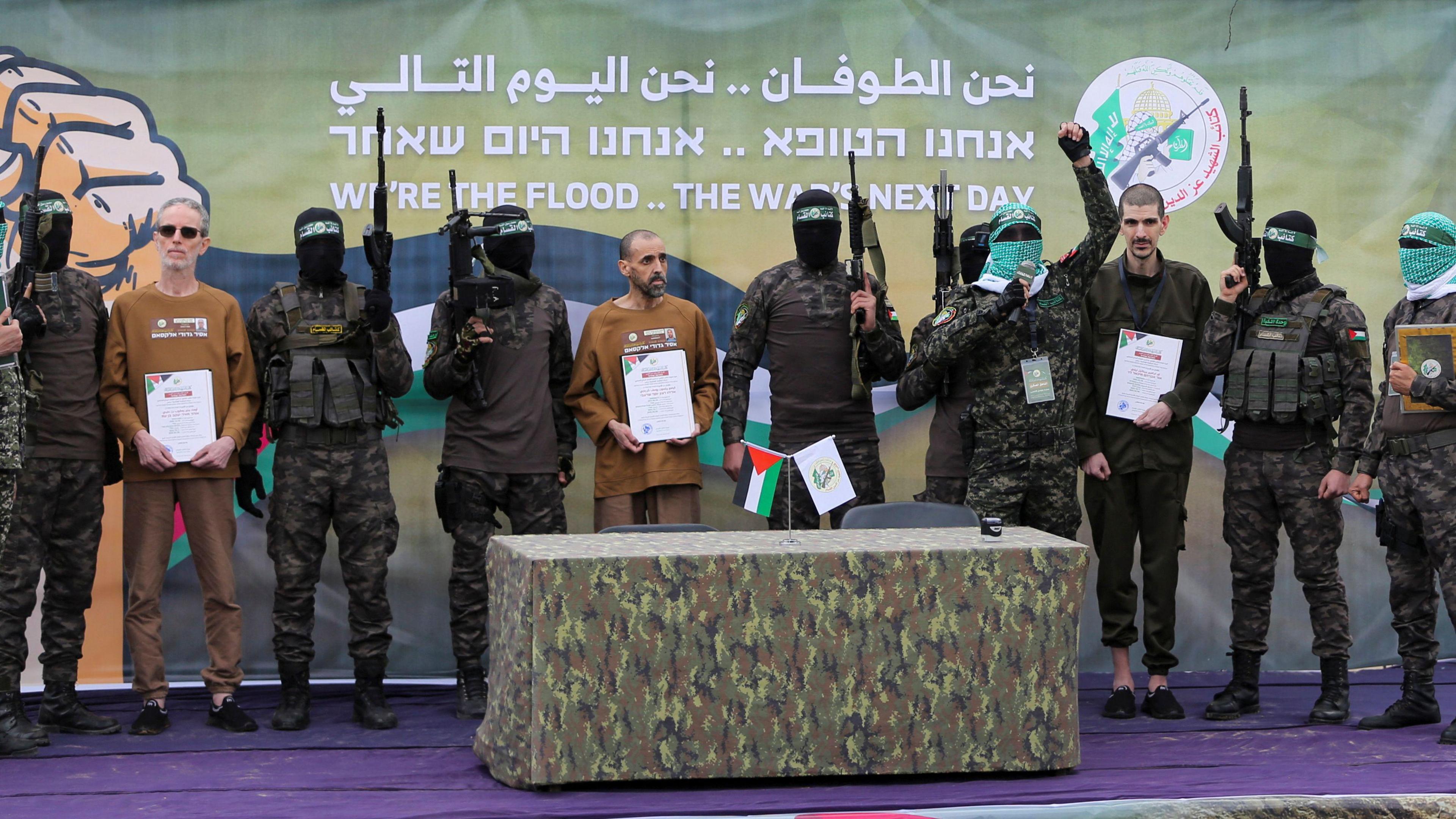 Or Levy, Eli Sharabi and Ohad Ben Ami, hostages held in Gaza since the deadly October 7, 2023 attack, are released by Hamas militants as part of a ceasefire and a hostages-prisoners swap deal between Hamas and Israel in Deir Al-Balah in the central Gaza Strip, February 8, 2025.